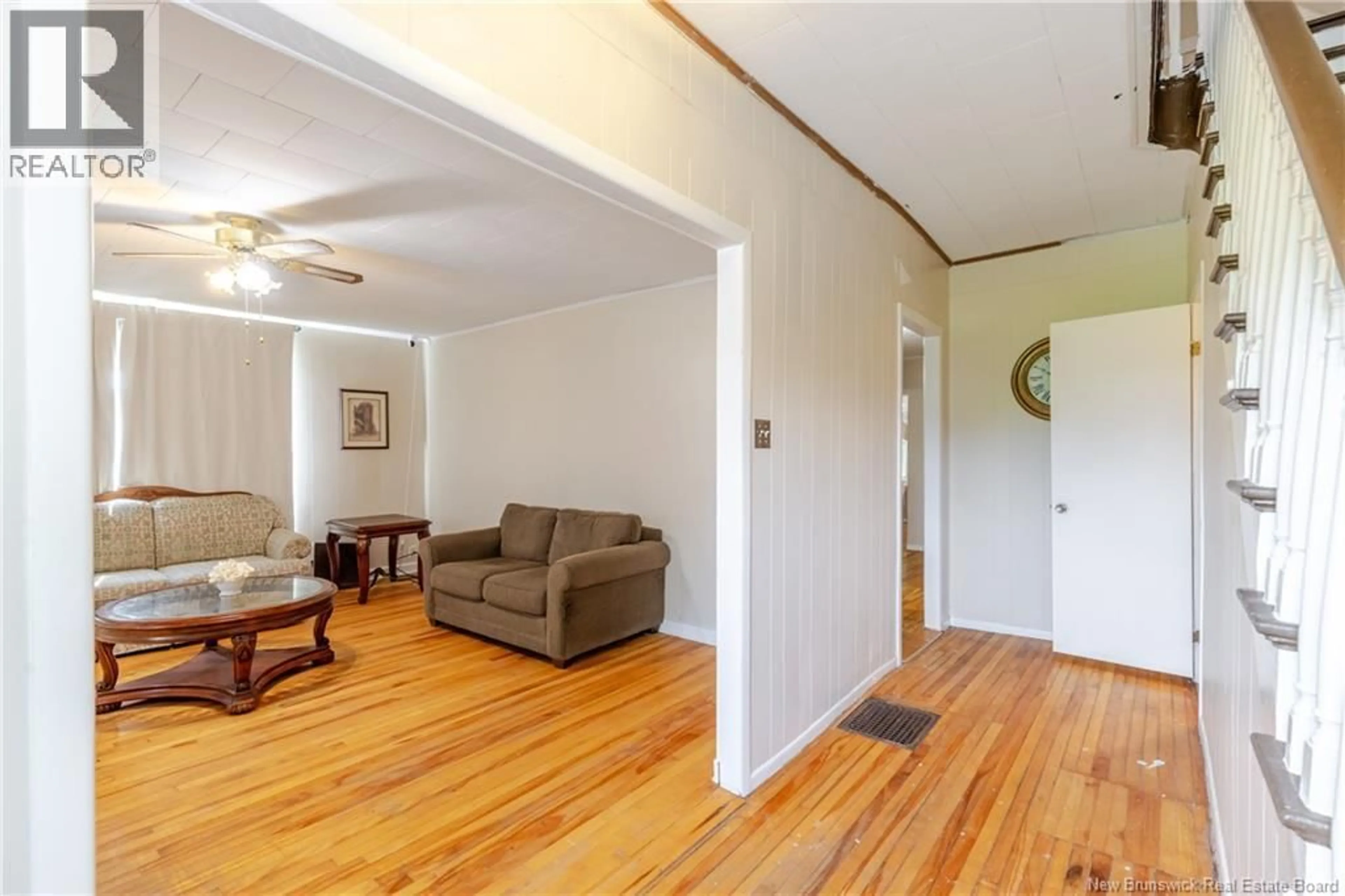 Living room with furniture, wood/laminate floor for 109 VICTORIA STREET, Woodstock New Brunswick E7M3A4