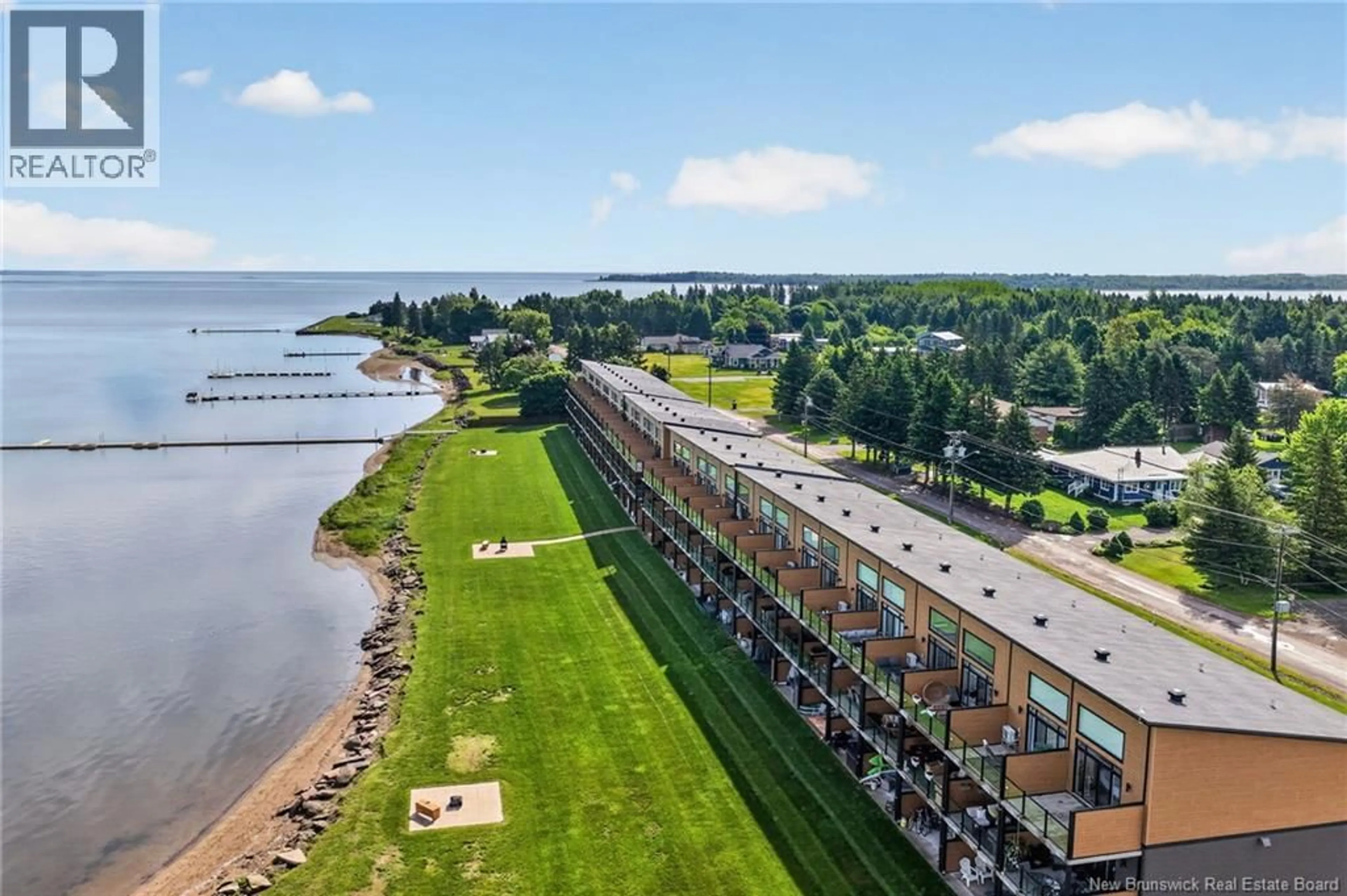 A pic from outside/outdoor area/front of a property/back of a property/a pic from drone, water/lake/river/ocean view for 104 - 3808 ROUTE 134, Shediac Bridge New Brunswick E4R1T5