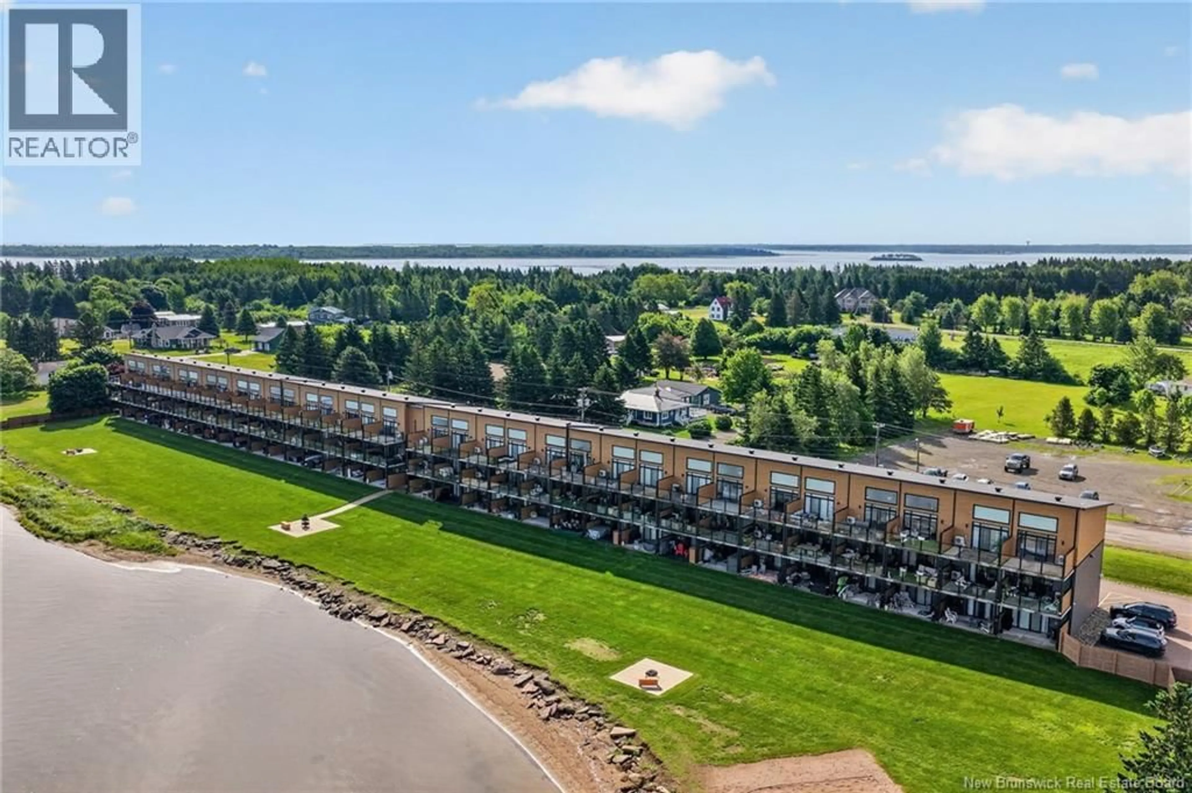 A pic from outside/outdoor area/front of a property/back of a property/a pic from drone, water/lake/river/ocean view for 104 - 3808 ROUTE 134, Shediac Bridge New Brunswick E4R1T5