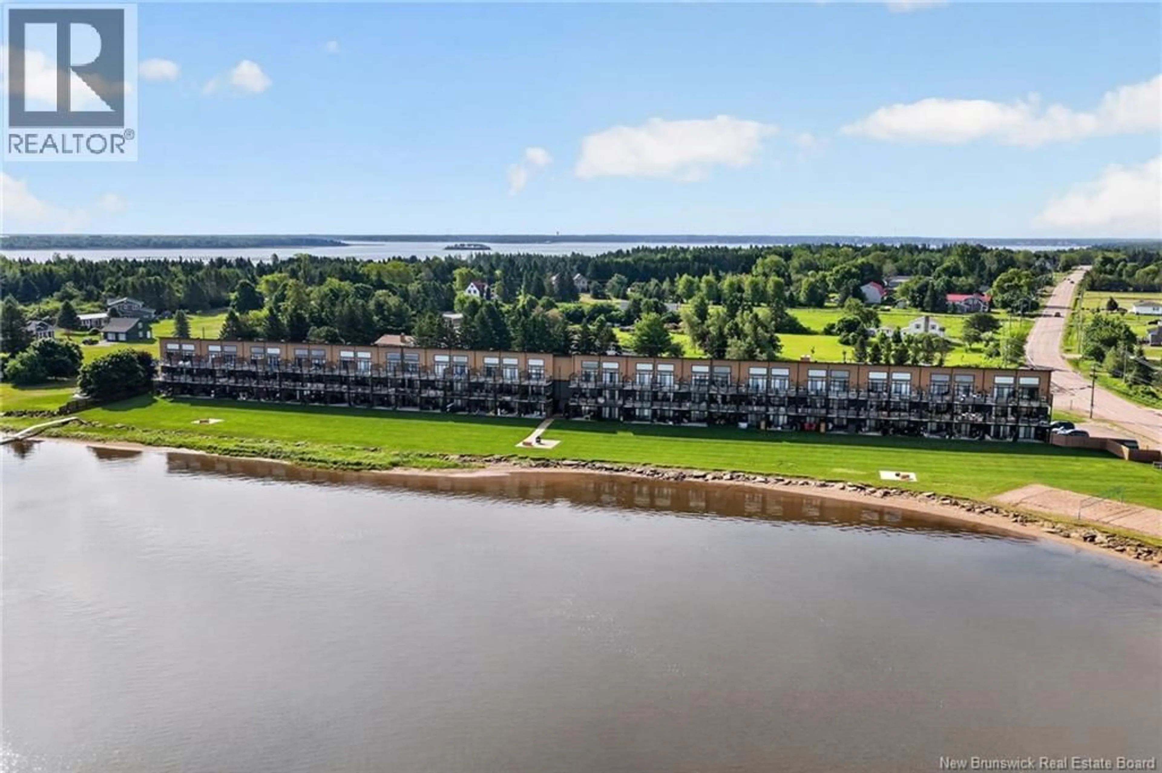 A pic from outside/outdoor area/front of a property/back of a property/a pic from drone, water/lake/river/ocean view for 104 - 3808 ROUTE 134, Shediac Bridge New Brunswick E4R1T5