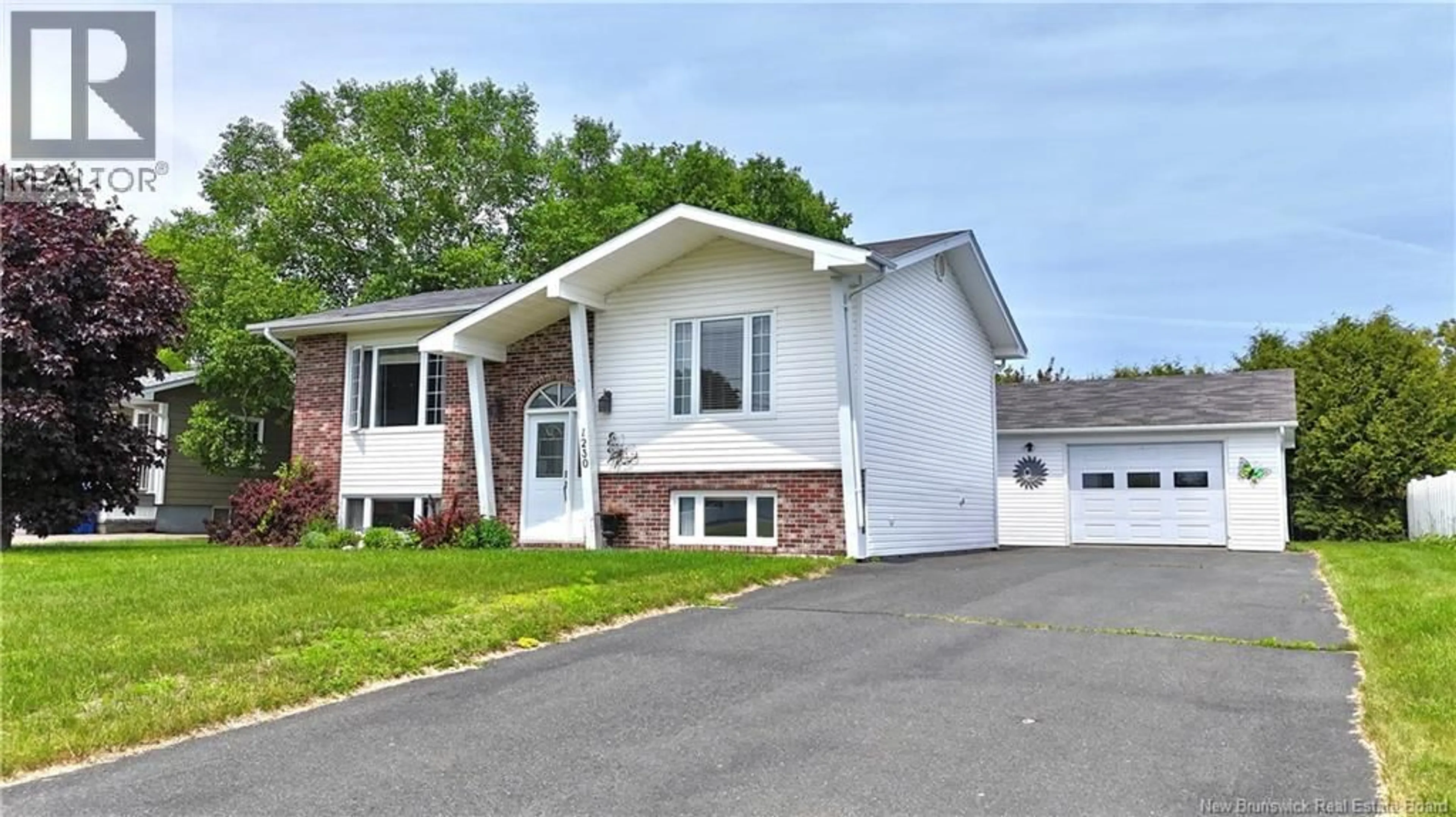 Home with vinyl exterior material, street for 1230 OCEAN RIDGE, Bathurst New Brunswick E2A4R7