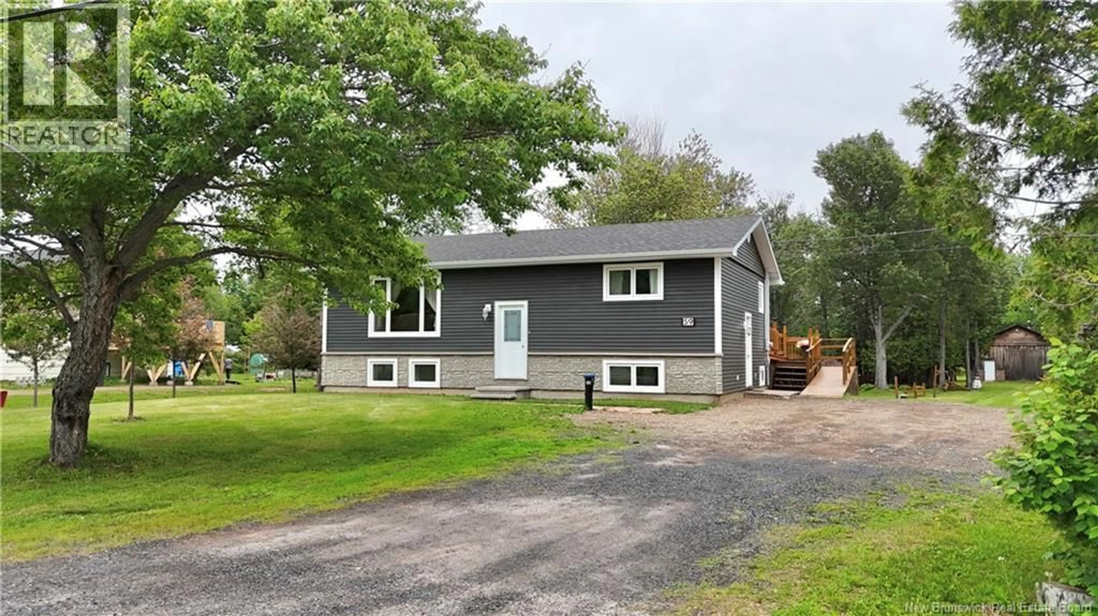 Home with vinyl exterior material, street for 59 SAINT ANDRE, Sainte-Anne New Brunswick E2A7Z1