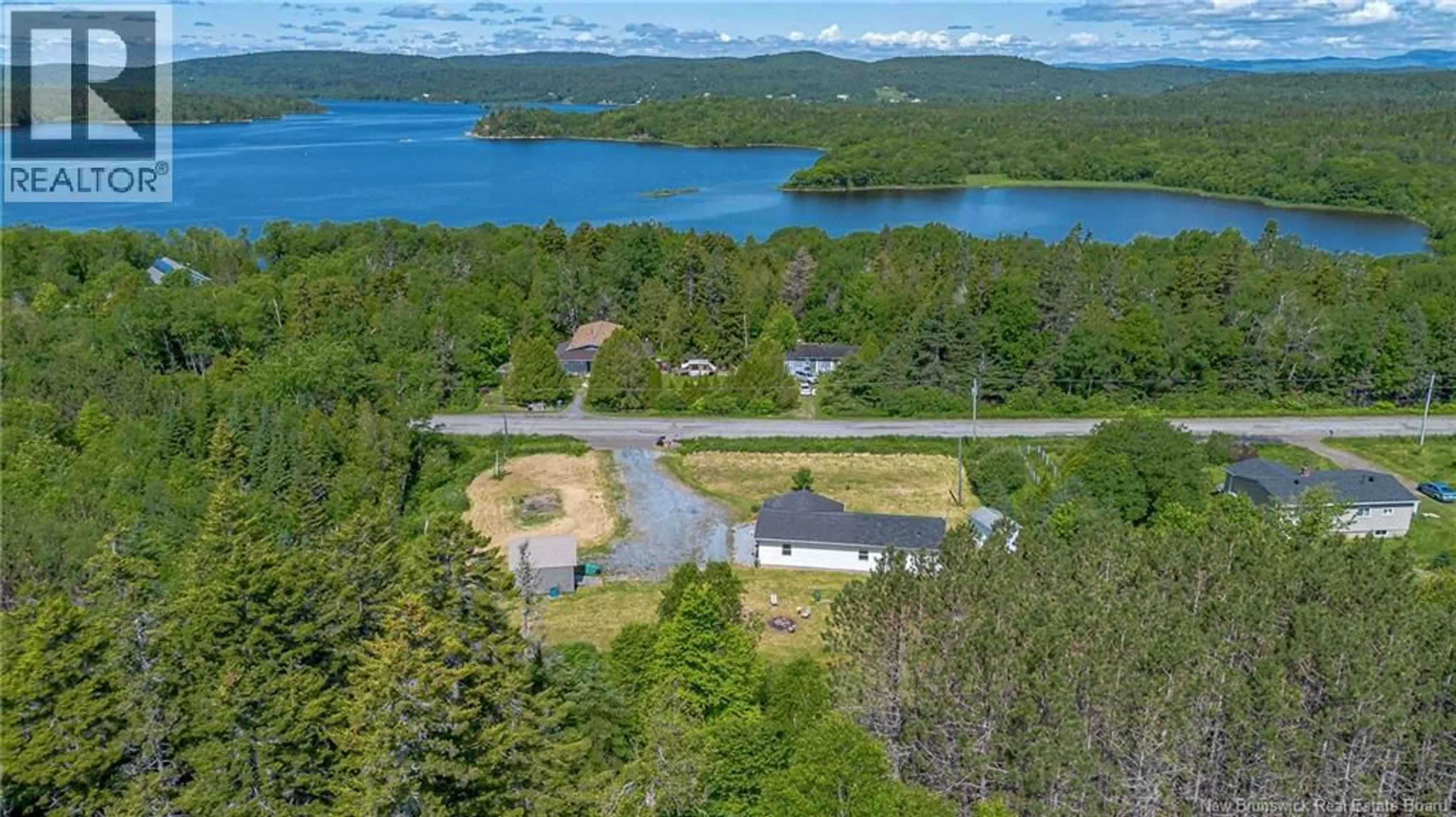 A pic from outside/outdoor area/front of a property/back of a property/a pic from drone, water/lake/river/ocean view for 33 SUMMERVILLE ROAD, Summerville New Brunswick E5S1G4