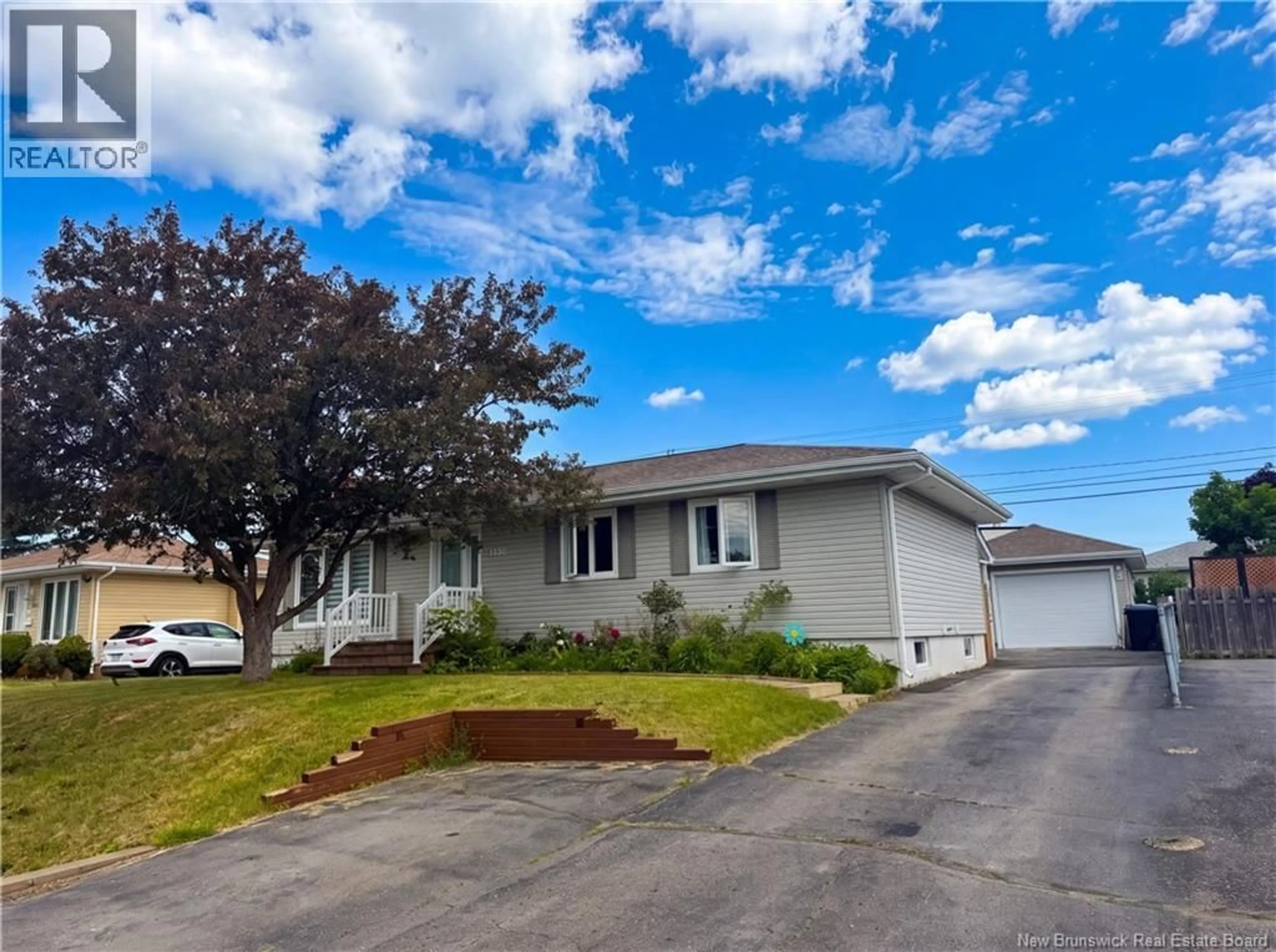 Home with vinyl exterior material, street for 1130 ROCKLAND DRIVE, Bathurst New Brunswick E2A3T9