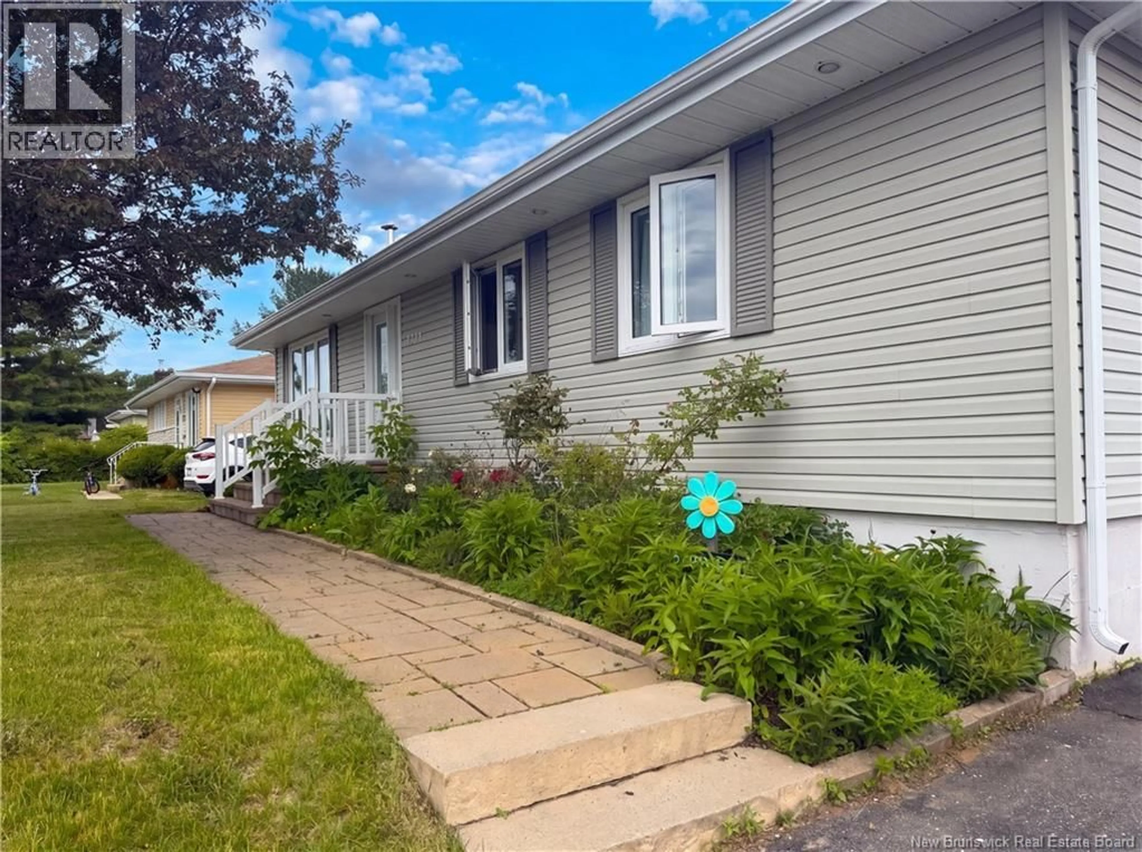 Home with vinyl exterior material, street for 1130 ROCKLAND DRIVE, Bathurst New Brunswick E2A3T9