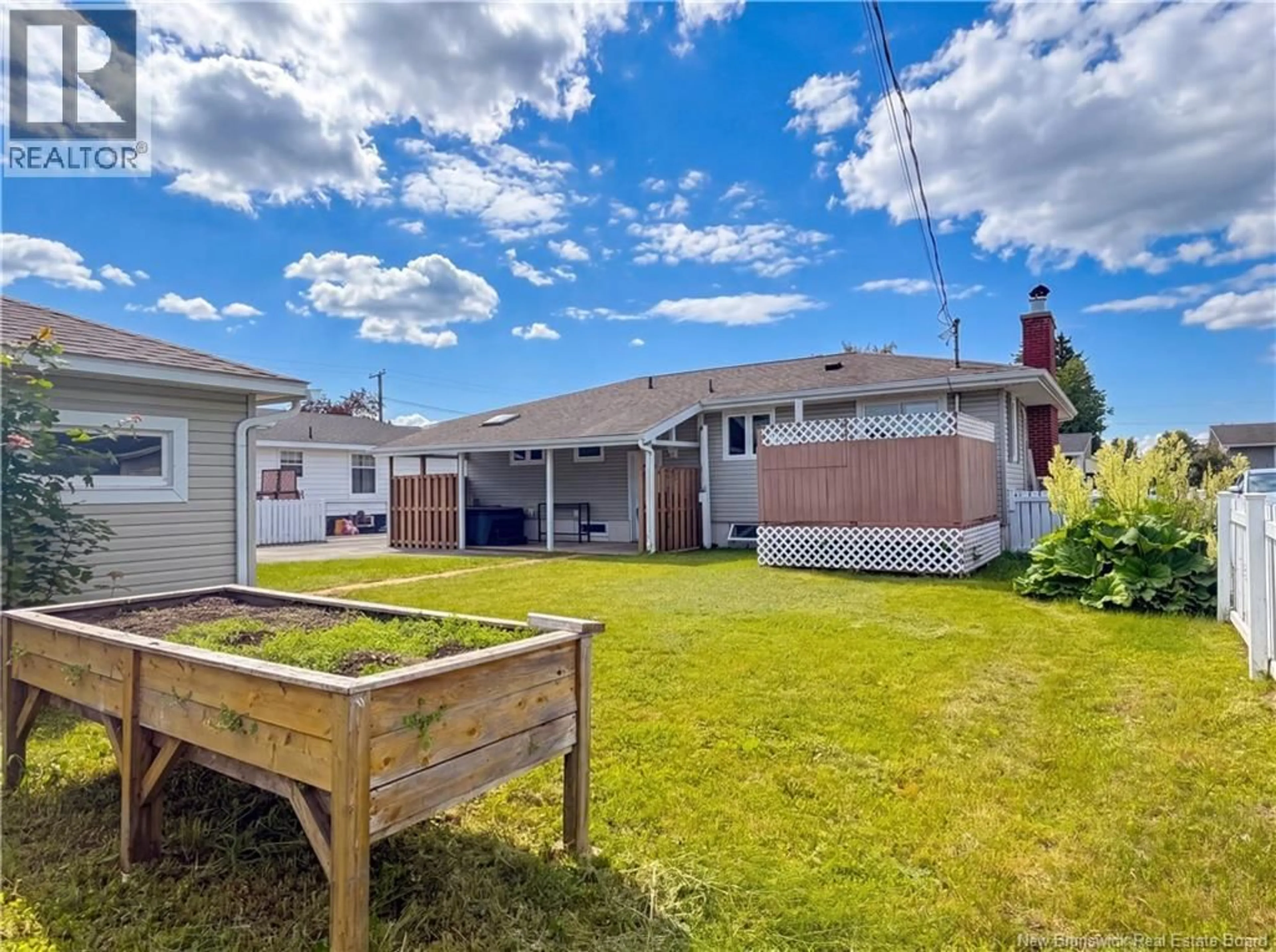 A pic from outside/outdoor area/front of a property/back of a property/a pic from drone, street for 1130 ROCKLAND DRIVE, Bathurst New Brunswick E2A3T9