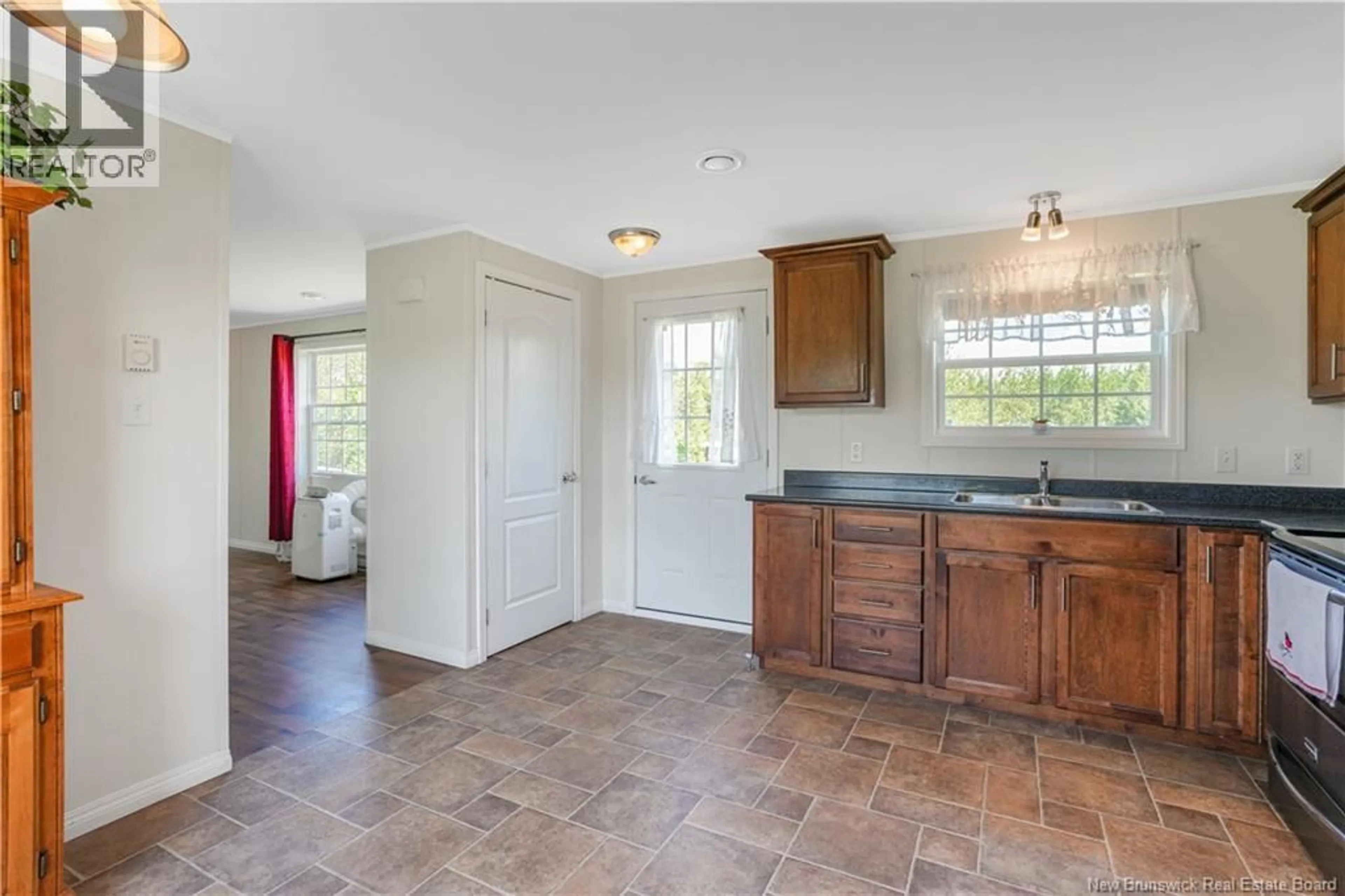 Open concept kitchen, ceramic/tile floor for 26 CARRIE STREET, Rusagonis New Brunswick E3B0T2