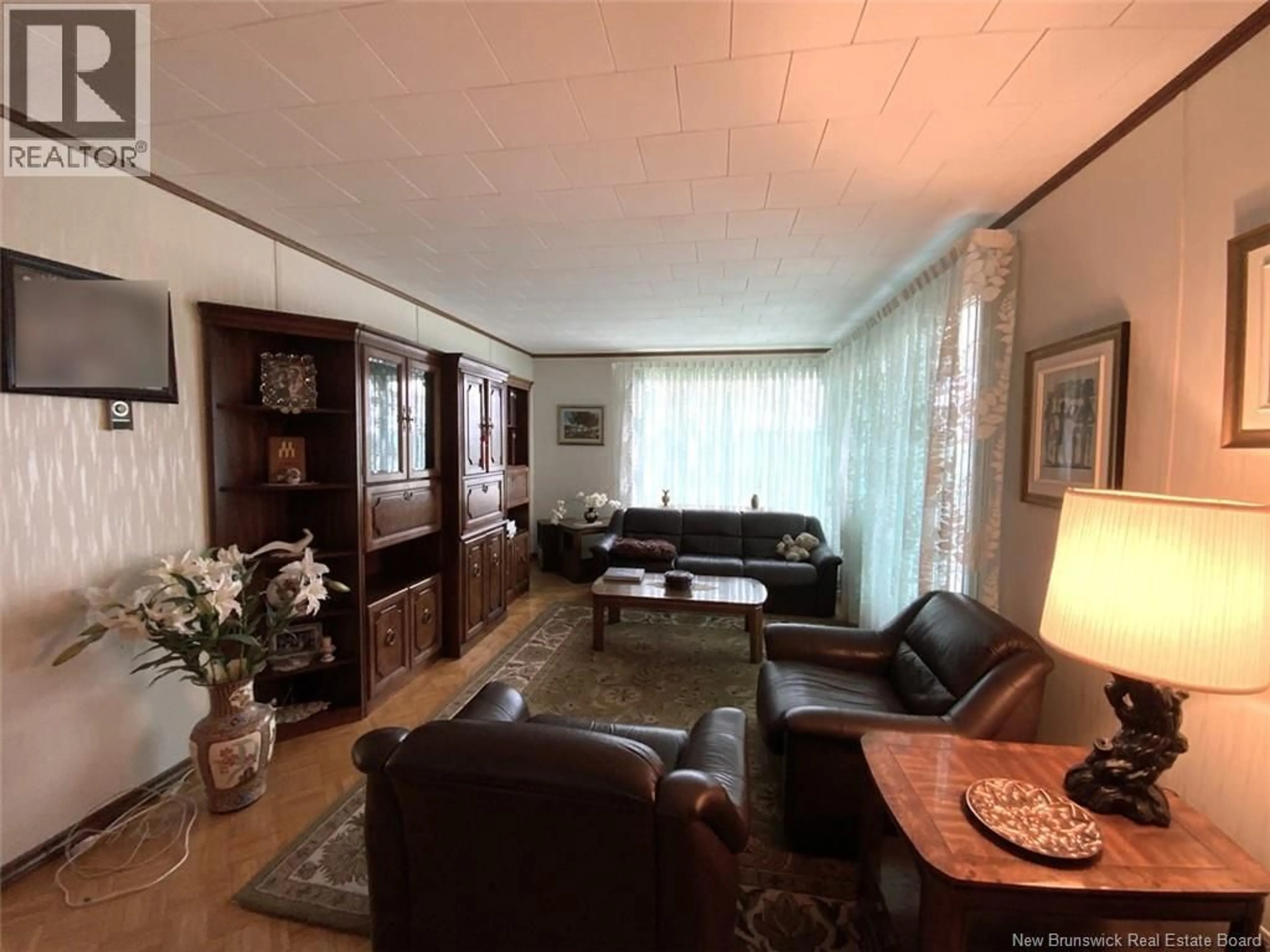 Living room with furniture, unknown for 103 J-GASPARD-BOUCHER AVENUE, Edmundston New Brunswick E3V1P8