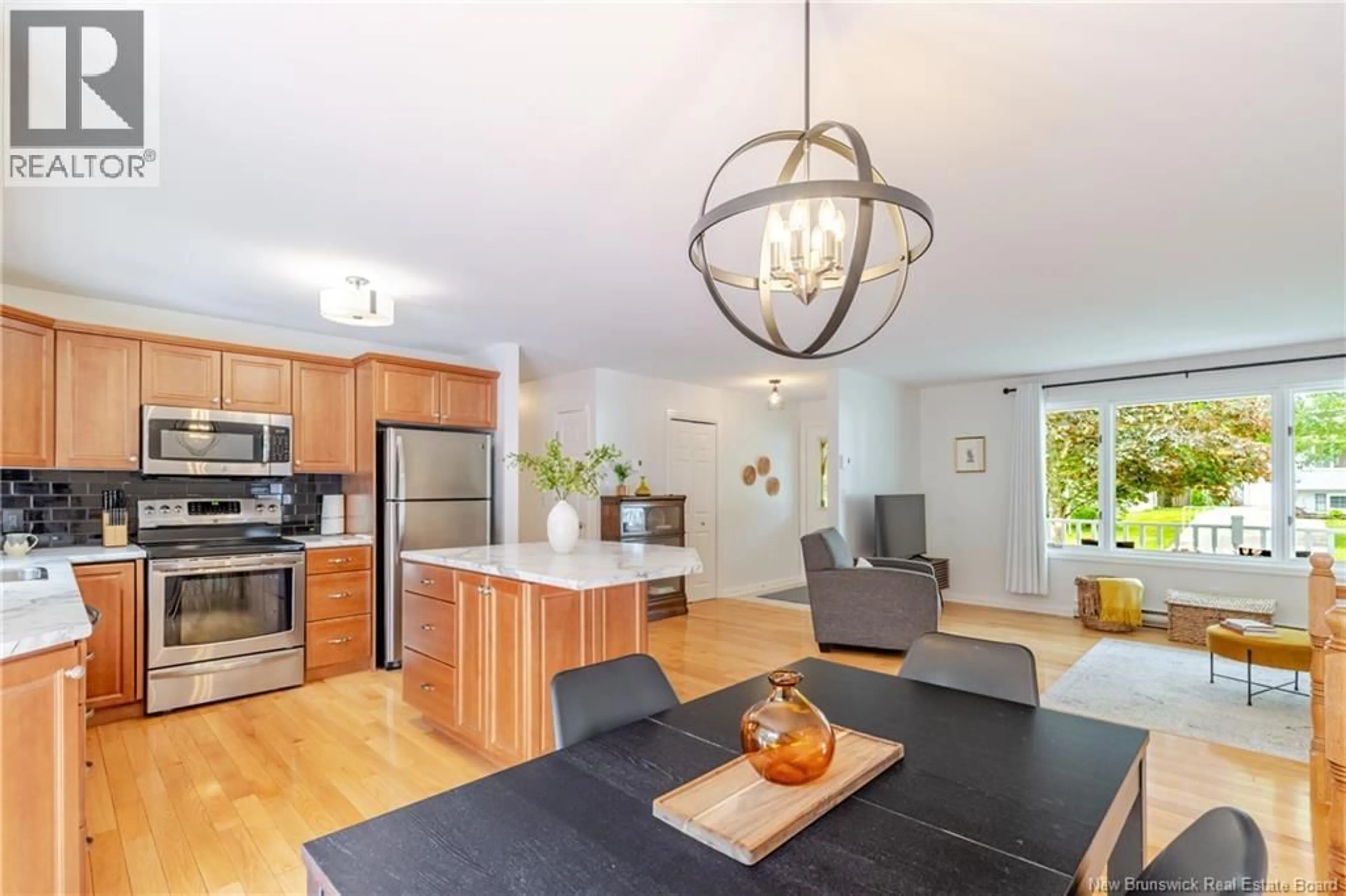 Open concept kitchen, wood/laminate floor for 34 PETTIGROVE CRESCENT, Fredericton New Brunswick E3A5P3