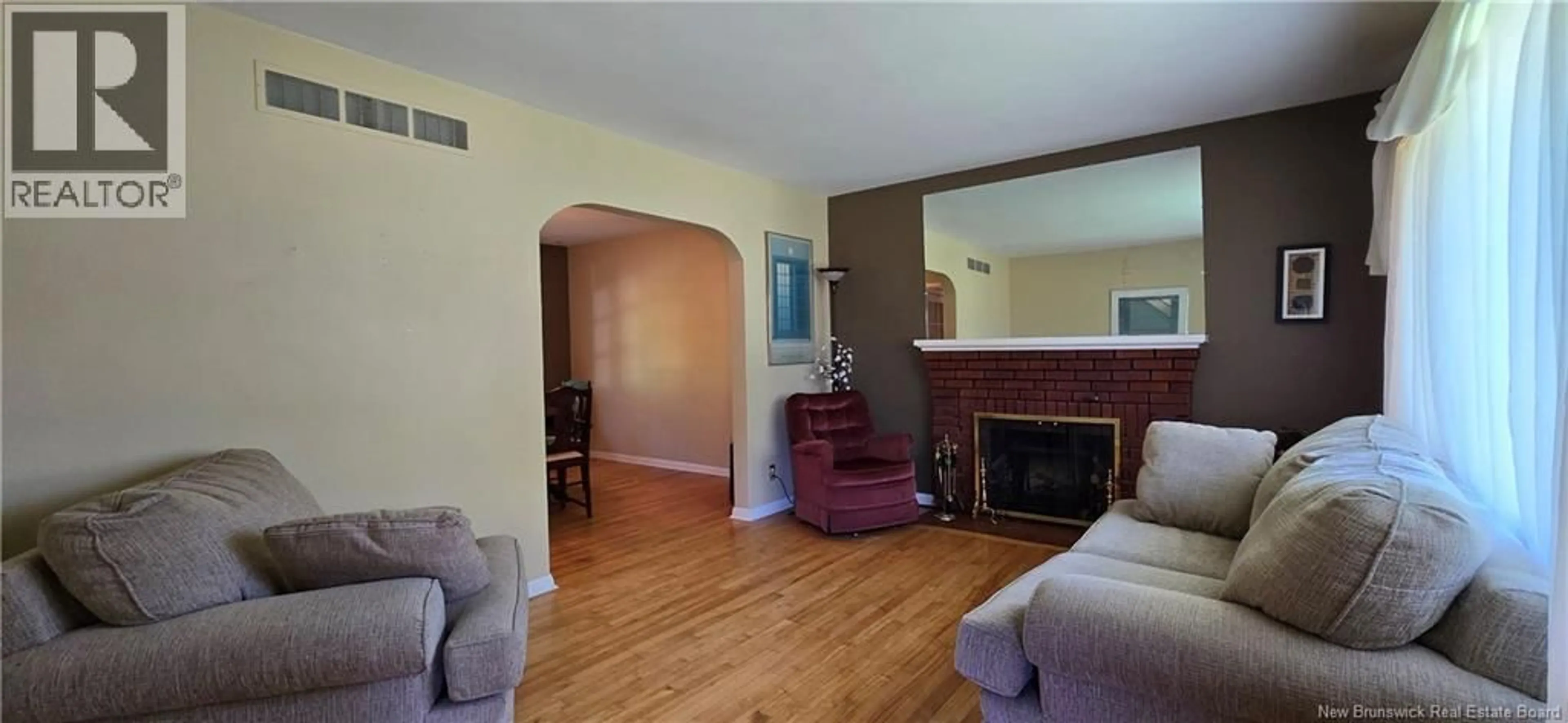Living room with furniture, wood/laminate floor for 217 MAPLE STREET, Moncton New Brunswick E1C6A7
