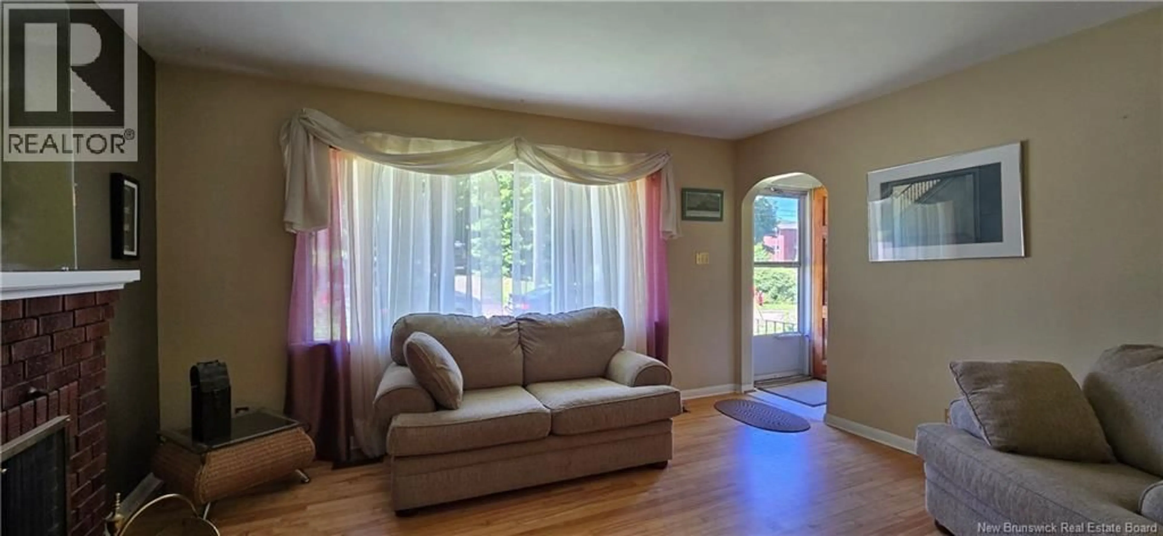 Living room with furniture, wood/laminate floor for 217 MAPLE STREET, Moncton New Brunswick E1C6A7