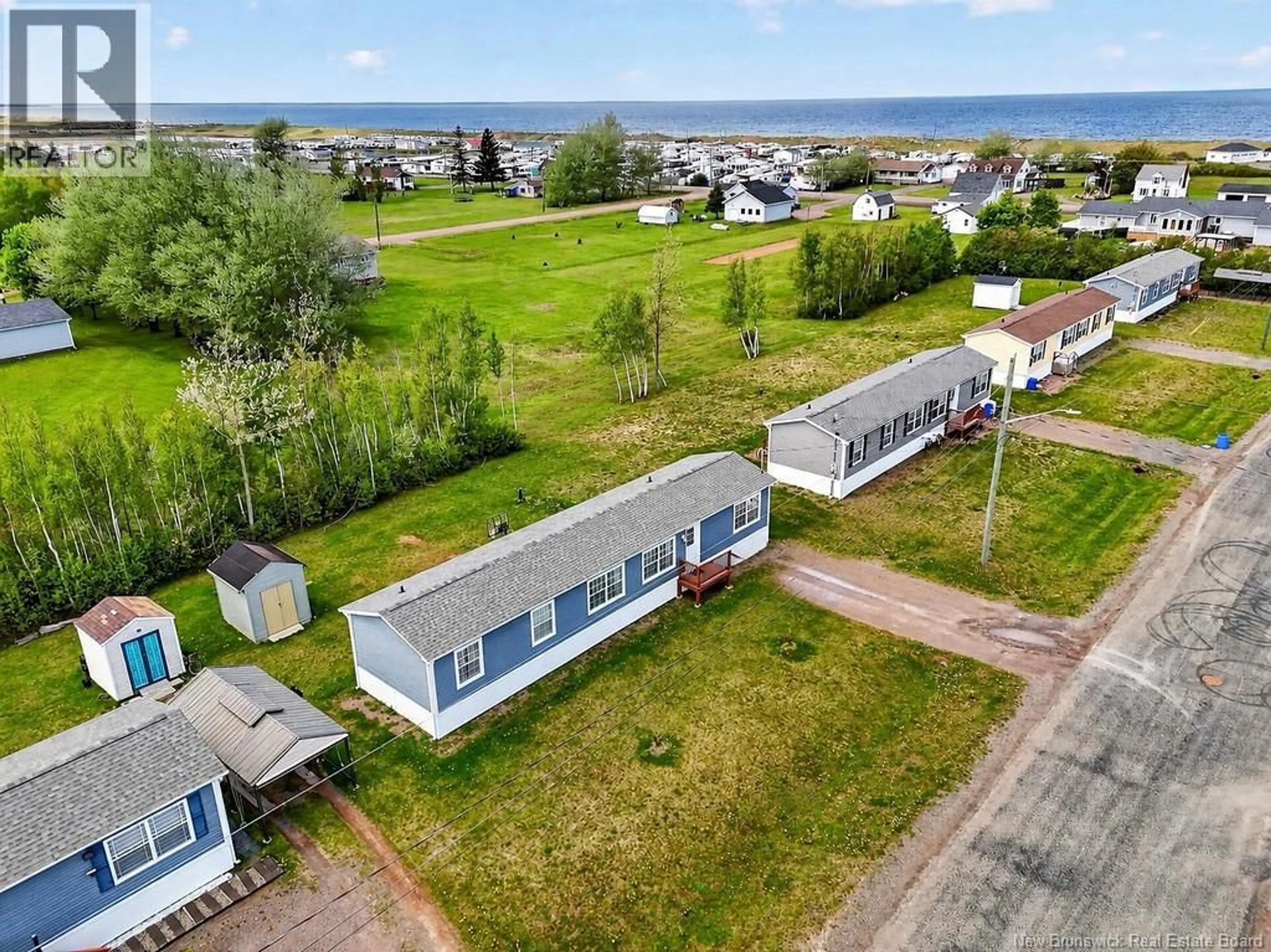 A pic from outside/outdoor area/front of a property/back of a property/a pic from drone, water/lake/river/ocean view for 19 RUE ANNA, Bas Cap Pele New Brunswick E4N0E3