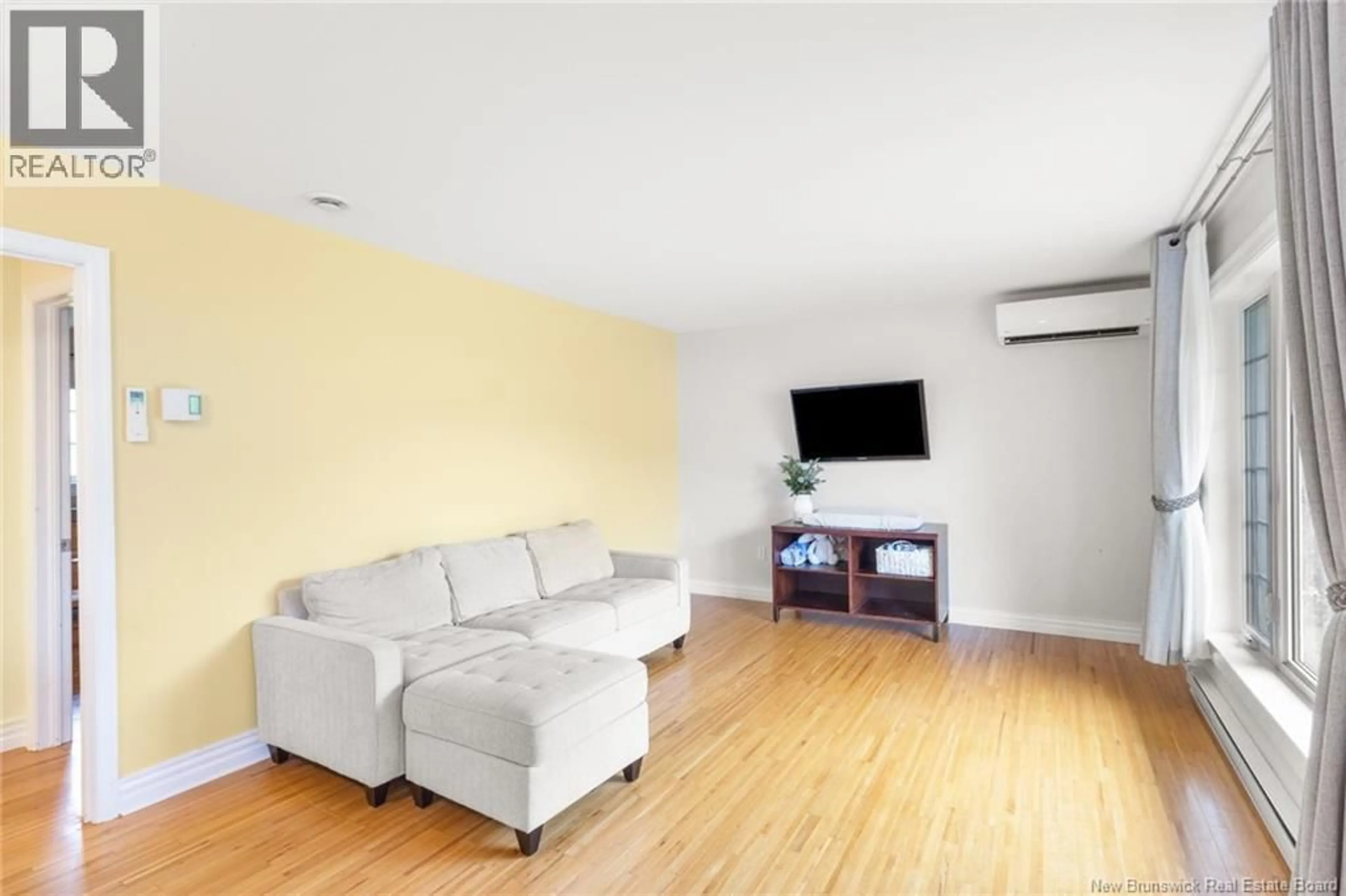 Living room with furniture, wood/laminate floor for 55 REICKER AVENUE, Beaver Dam New Brunswick E3B8B1