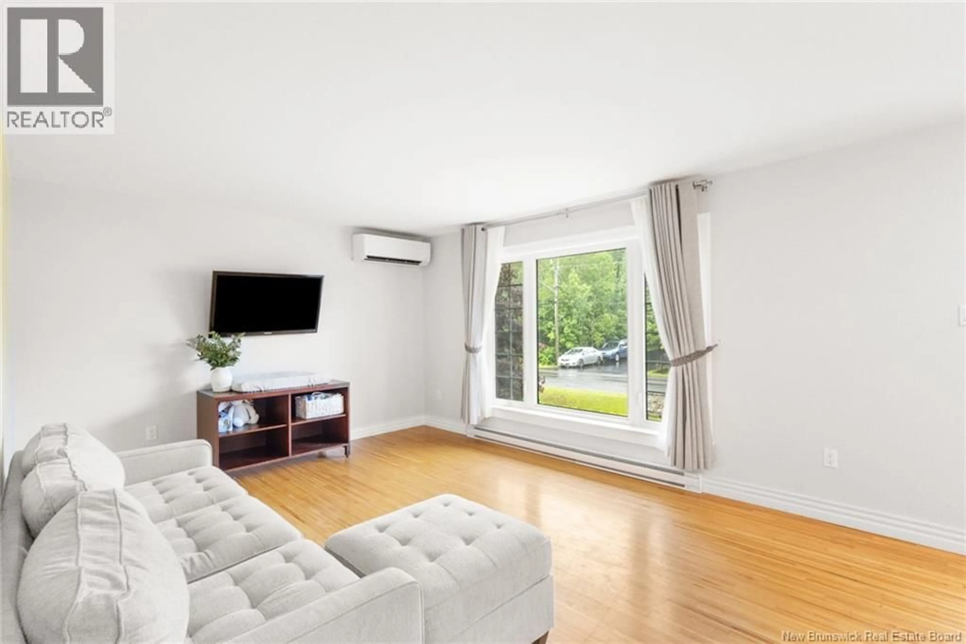 Living room with furniture, wood/laminate floor for 55 REICKER AVENUE, Beaver Dam New Brunswick E3B8B1