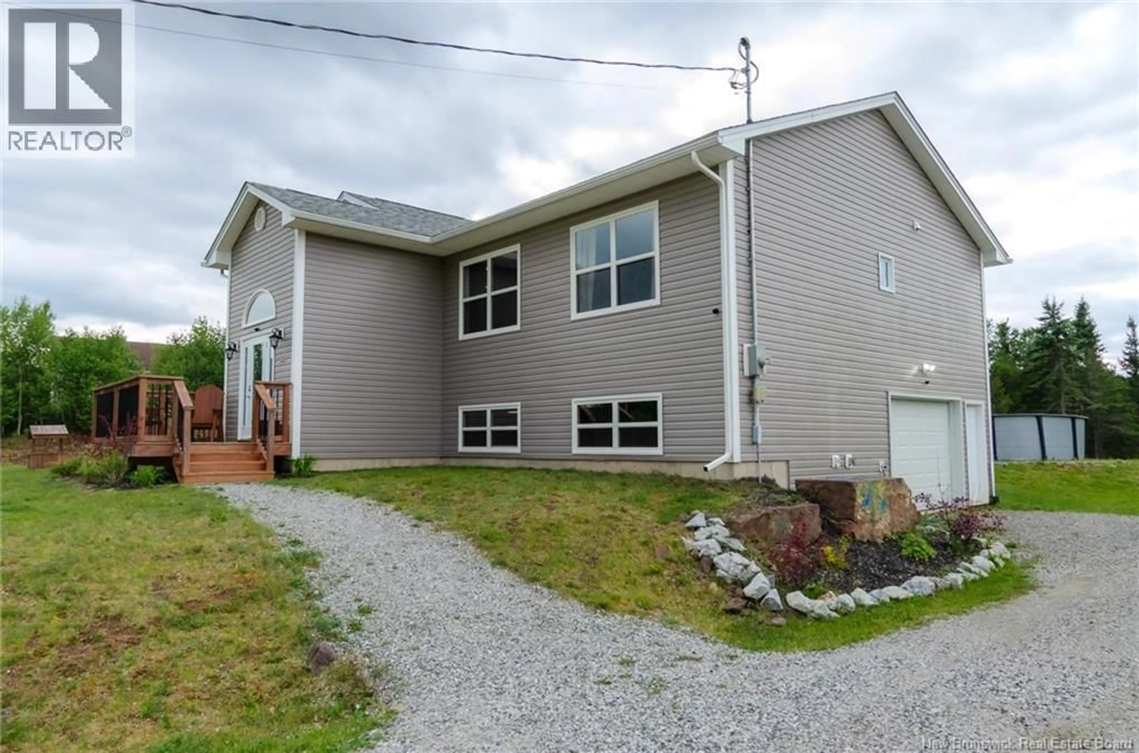 Home with vinyl exterior material, street for 360 PASSEKEAG ROAD, Hampton New Brunswick E5N7P2