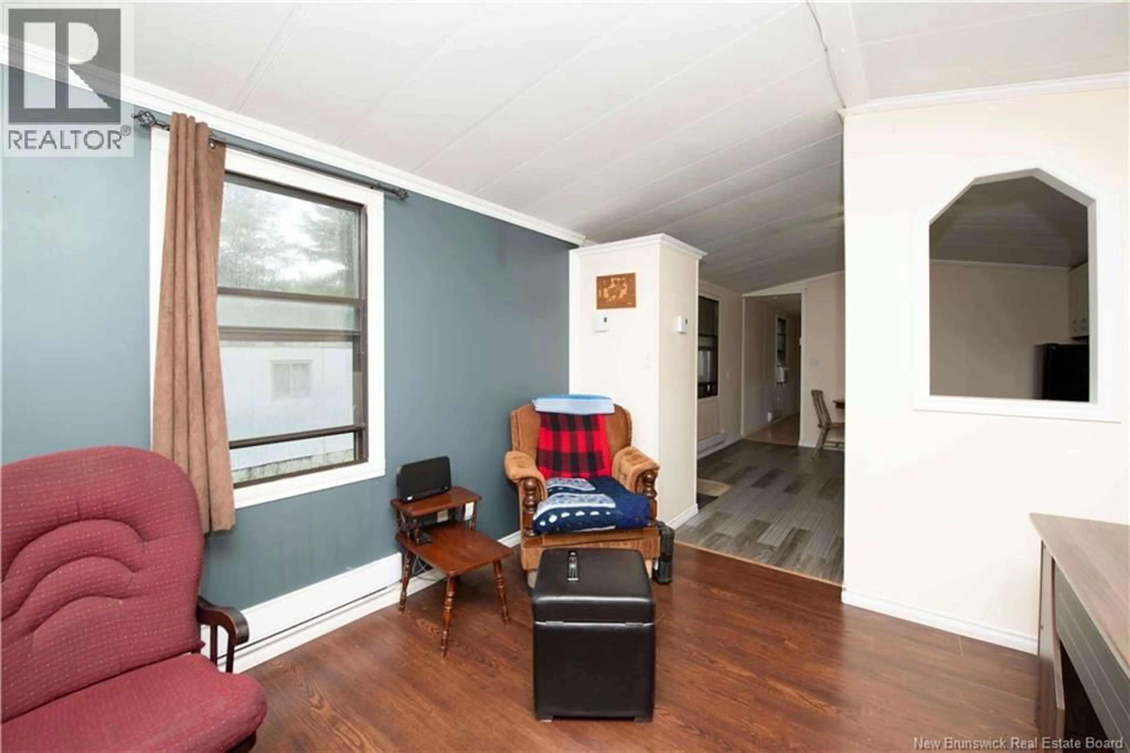 Living room with furniture, wood/laminate floor for 19 BIRCH GROVE ROAD, Lower Coverdale New Brunswick E1J1M2