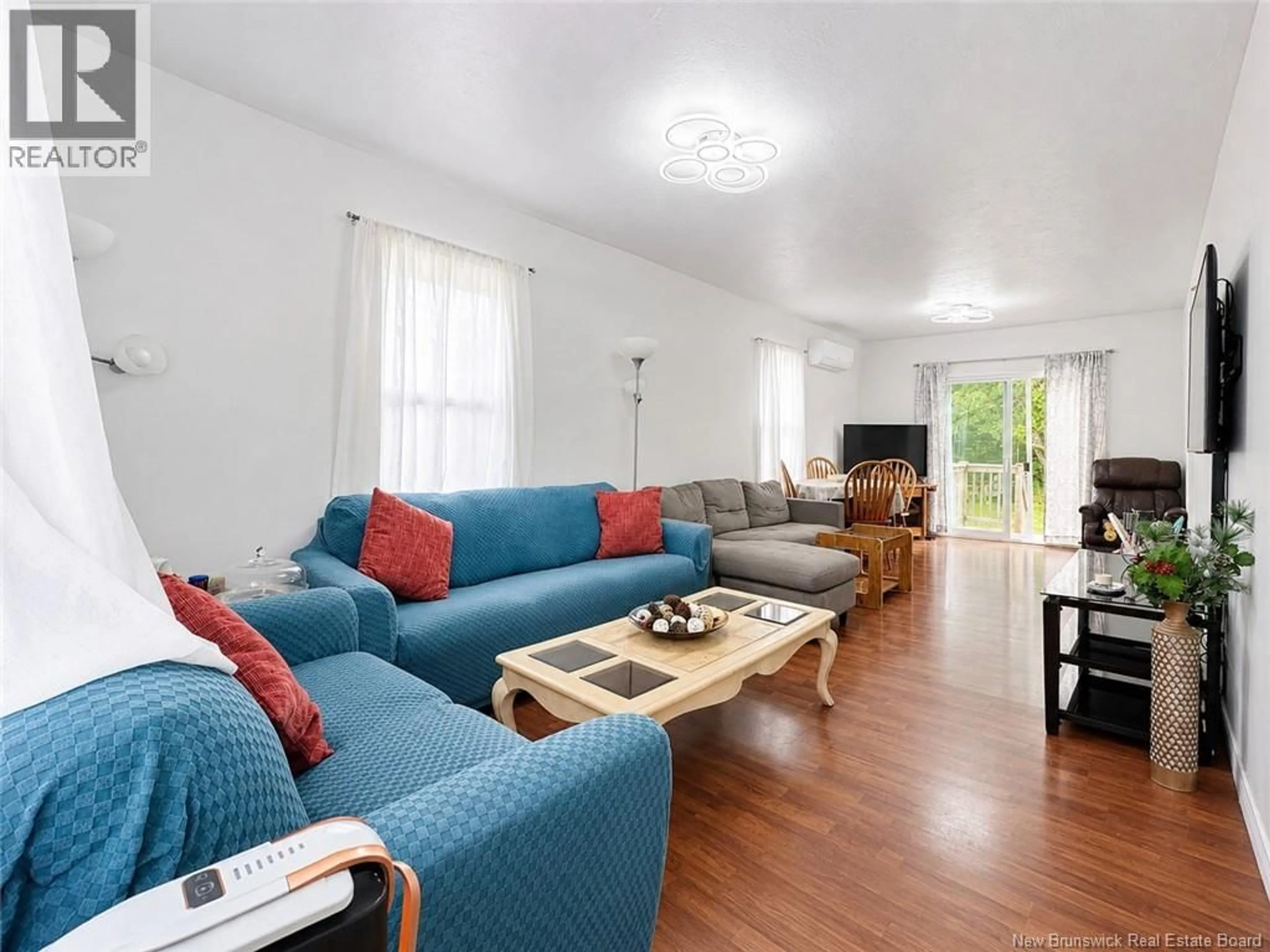 Living room with furniture, wood/laminate floor for 184 GOULD, Dieppe New Brunswick E1A1T9