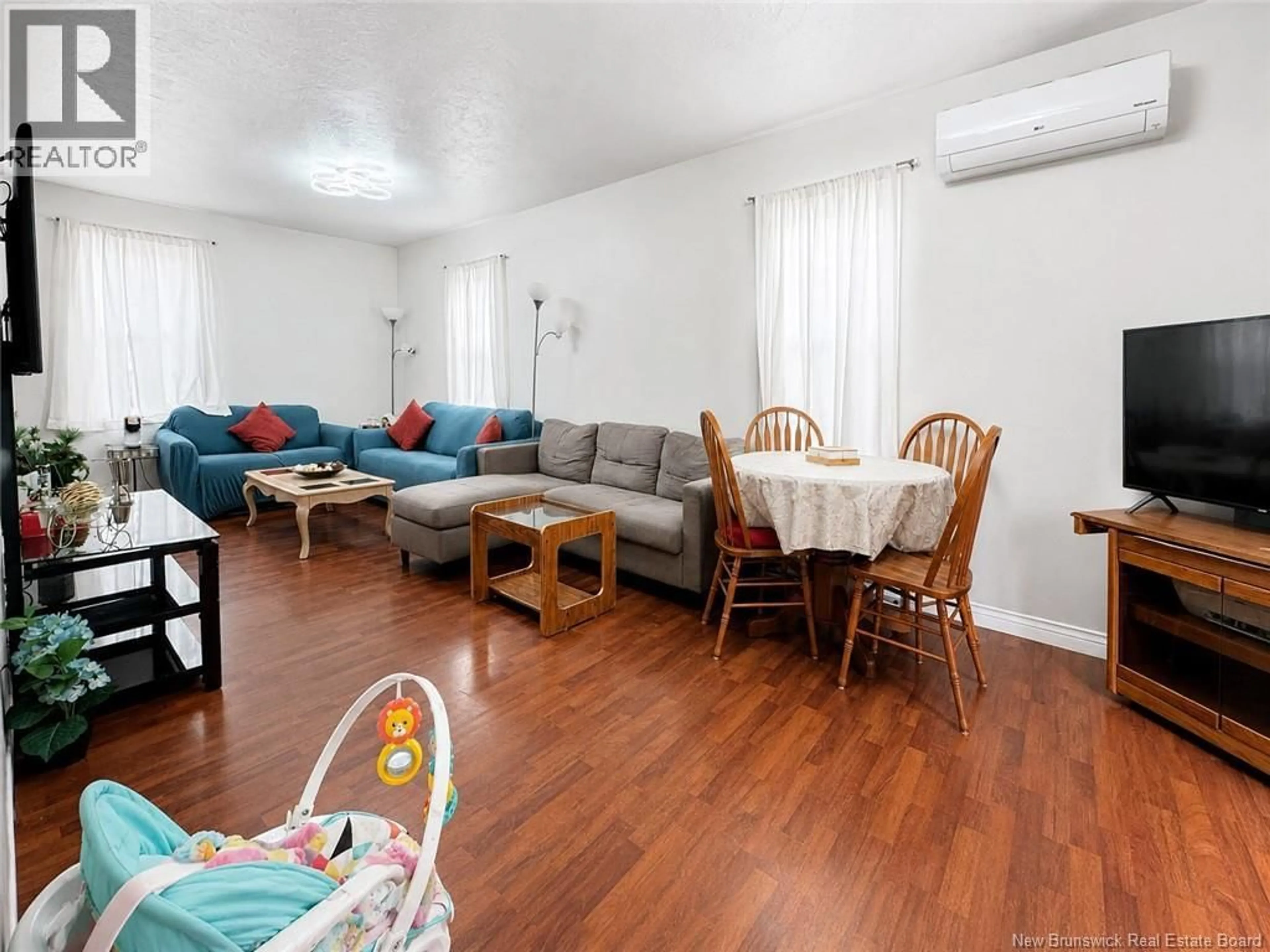 Living room with furniture, wood/laminate floor for 184 GOULD, Dieppe New Brunswick E1A1T9