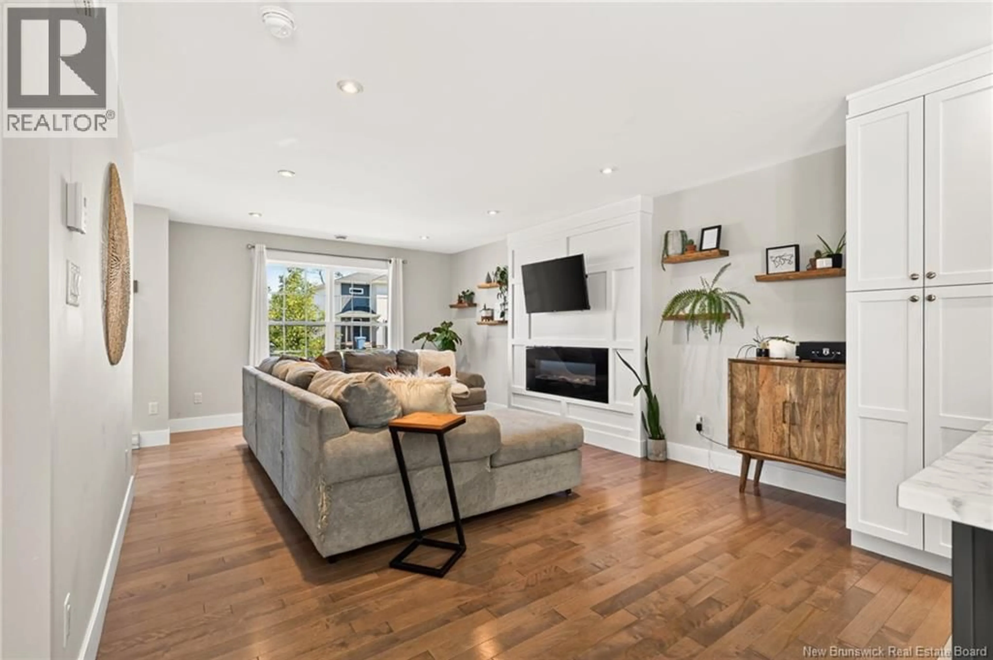 Living room with furniture, wood/laminate floor for 125 DES ERABLES, Dieppe New Brunswick E1A9B1