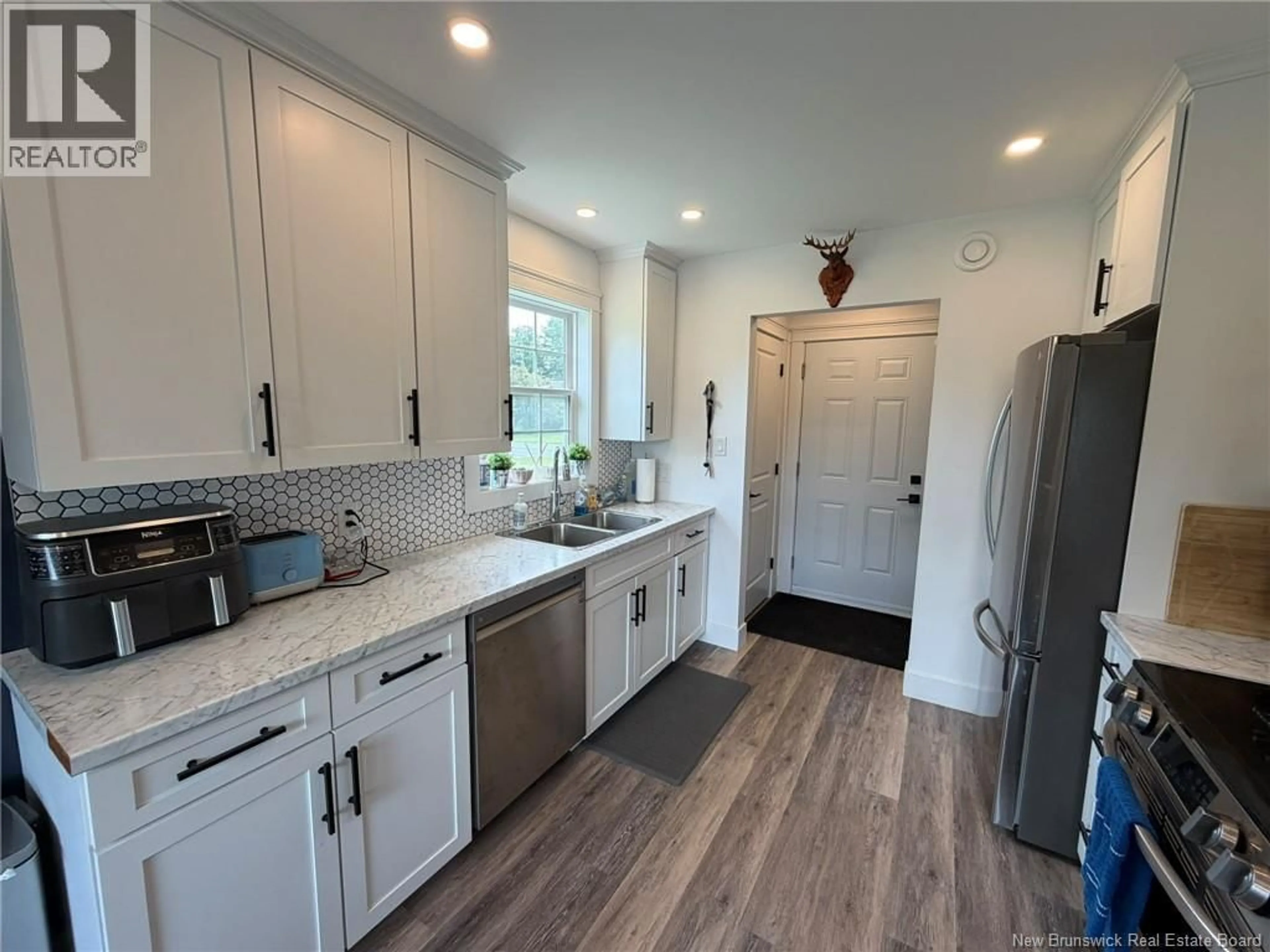 Open concept kitchen, ceramic/tile floor for 104 SQUIRES STREET, Woodstock New Brunswick E7M2S5