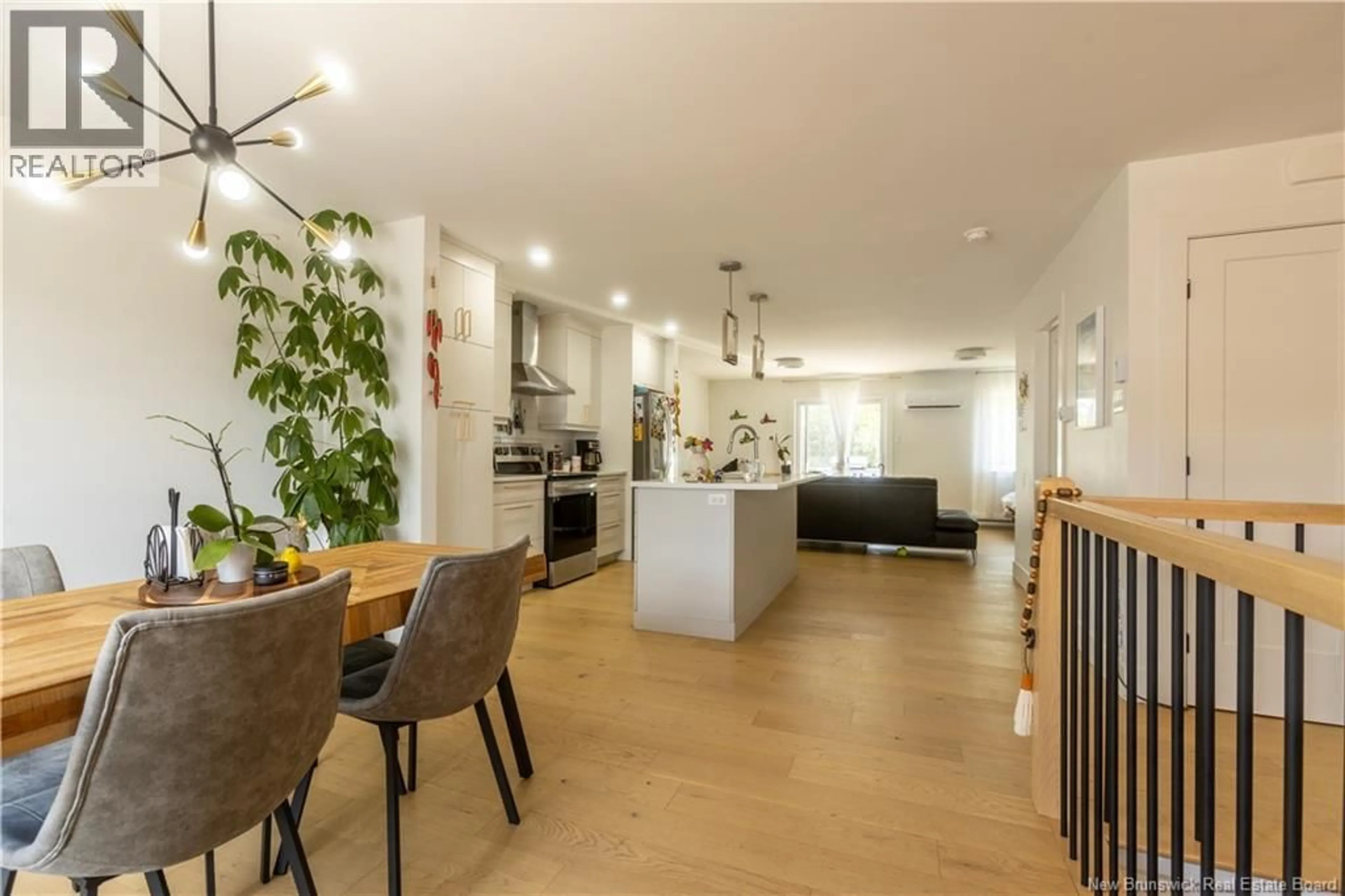 Open concept kitchen, wood/laminate floor for 30 BEAU DOMAINE COURT, Dieppe New Brunswick E1A9H5
