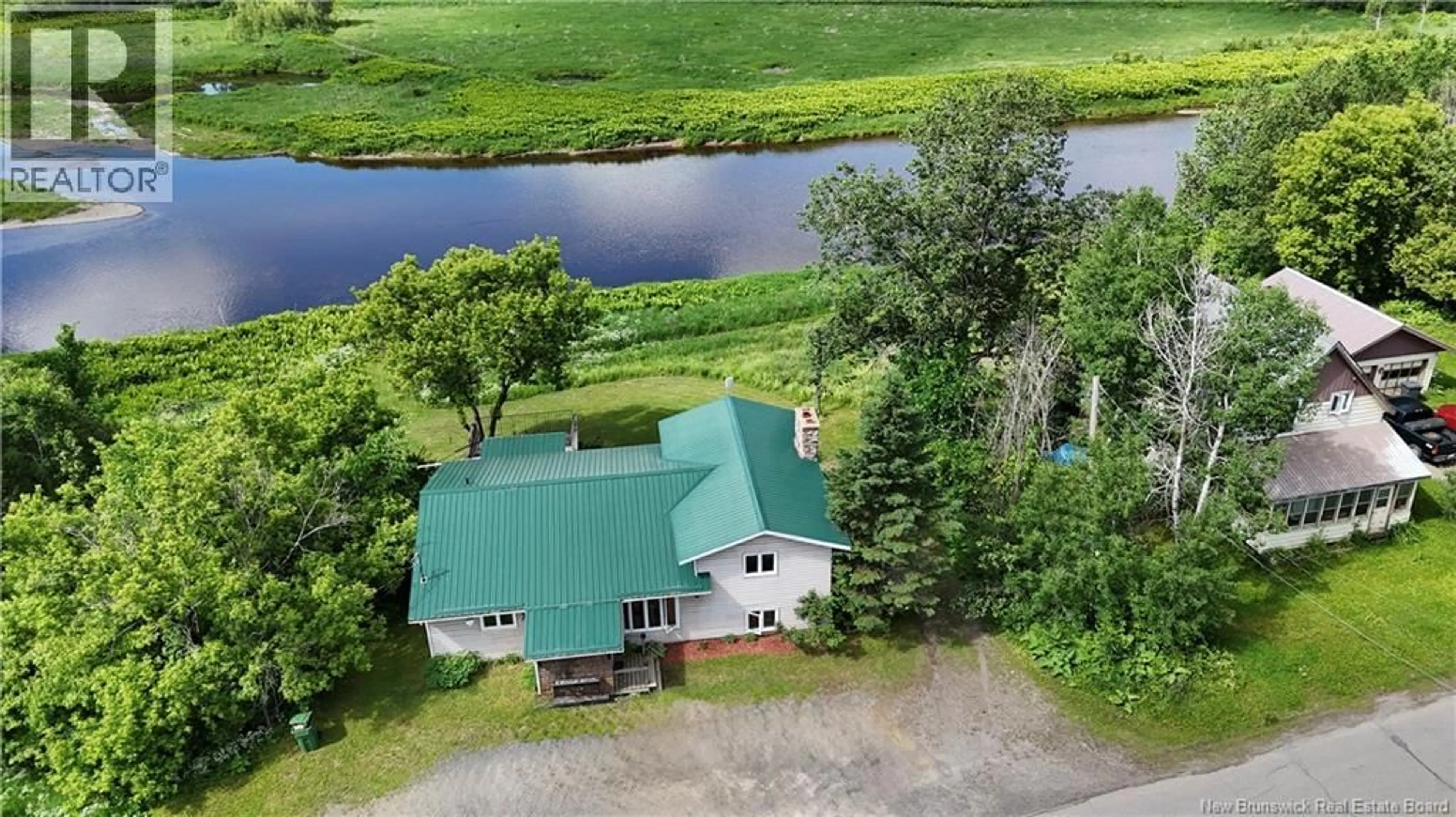 A pic from outside/outdoor area/front of a property/back of a property/a pic from drone, water/lake/river/ocean view for 403 TOBIQUE STREET, Plaster Rock New Brunswick E7G4A1
