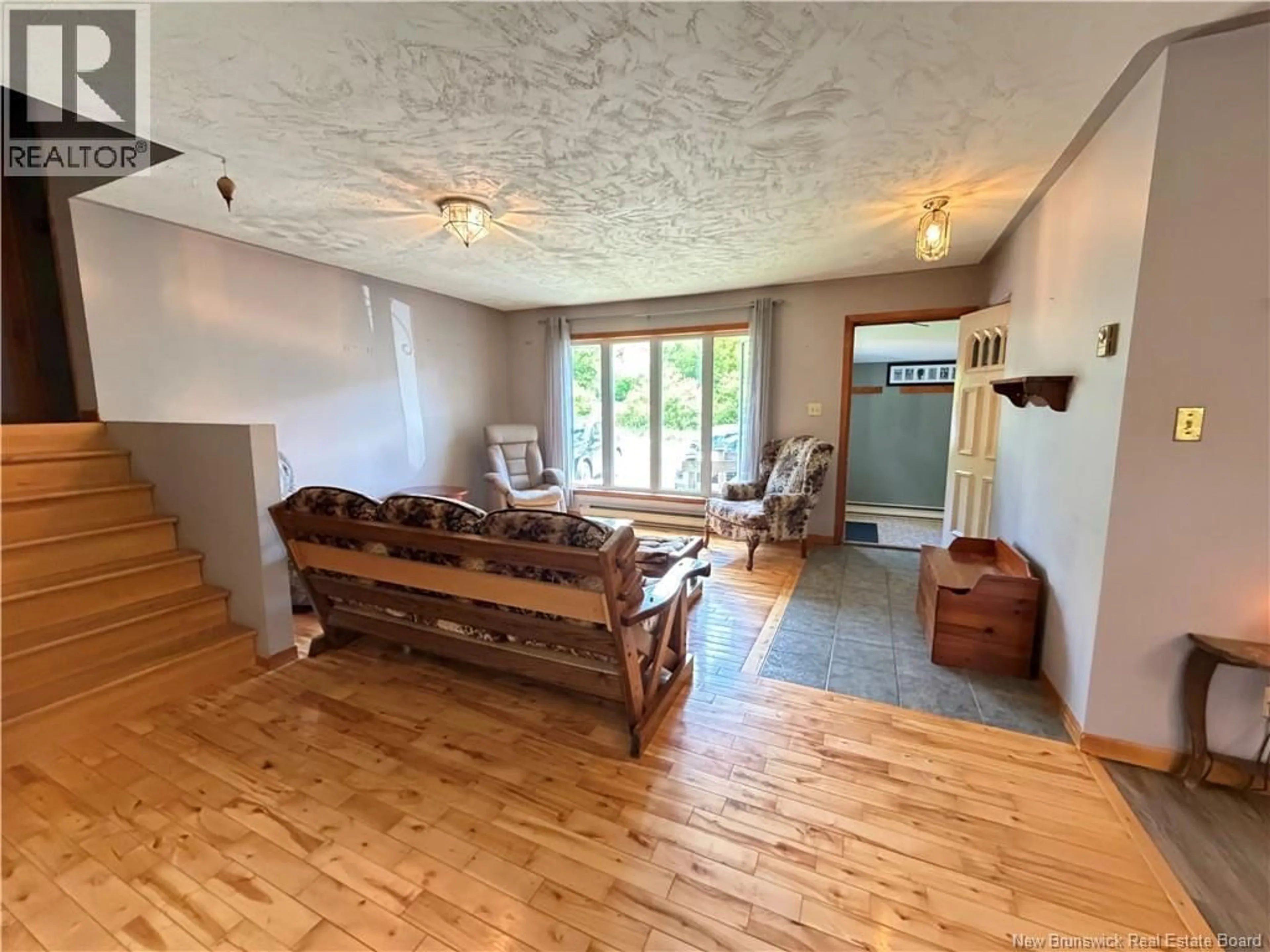 Living room with furniture, wood/laminate floor for 403 TOBIQUE STREET, Plaster Rock New Brunswick E7G4A1