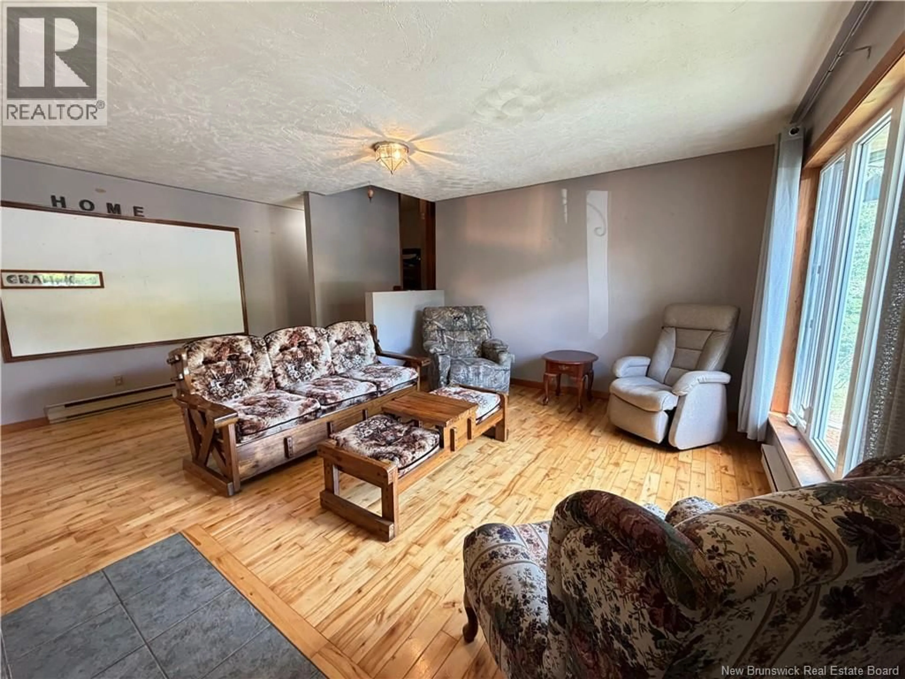 Living room with furniture, wood/laminate floor for 403 TOBIQUE STREET, Plaster Rock New Brunswick E7G4A1