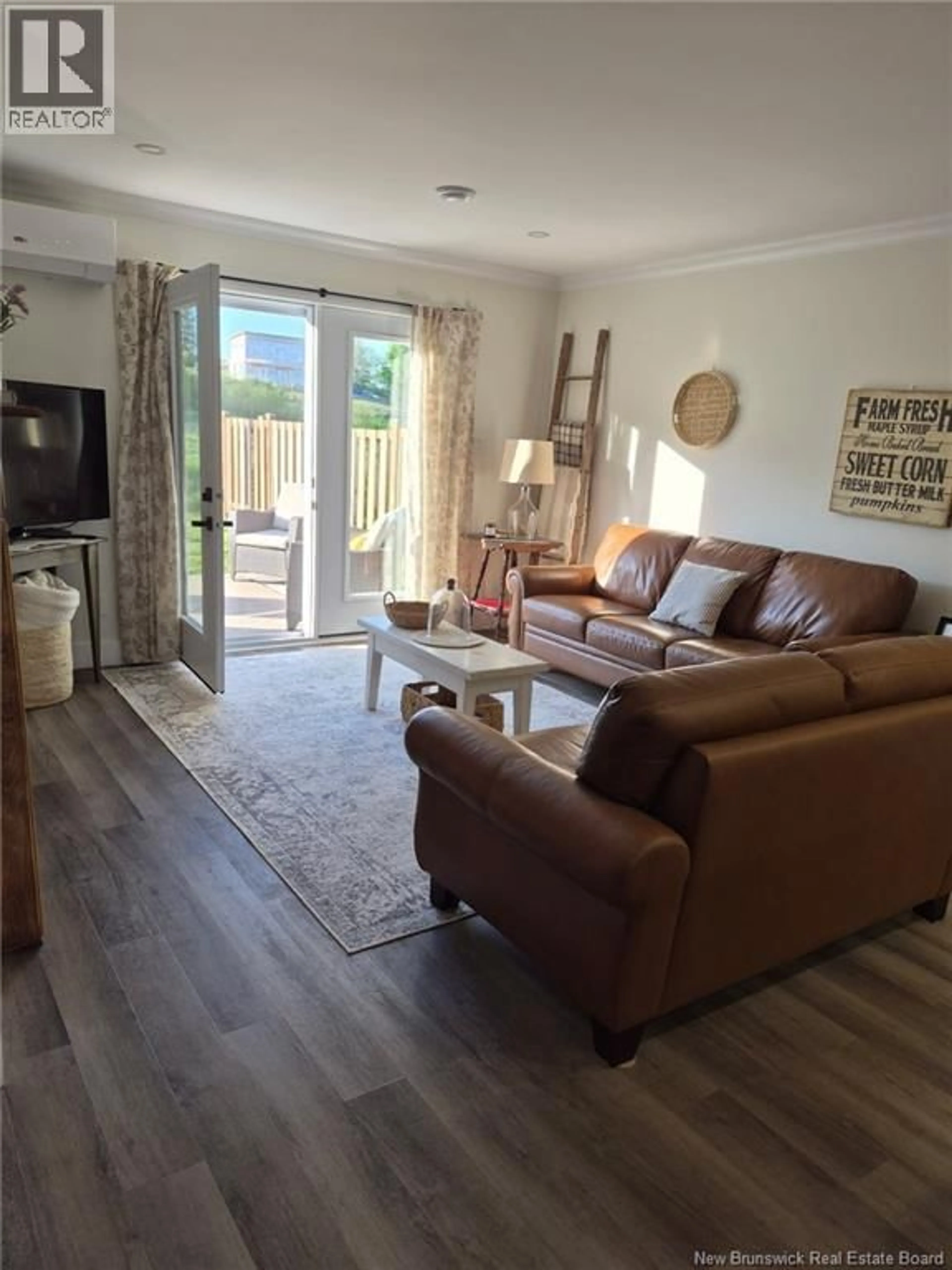 Living room with furniture, wood/laminate floor for 34 KING FISHER LANE, Apohaqui New Brunswick E5P3G2