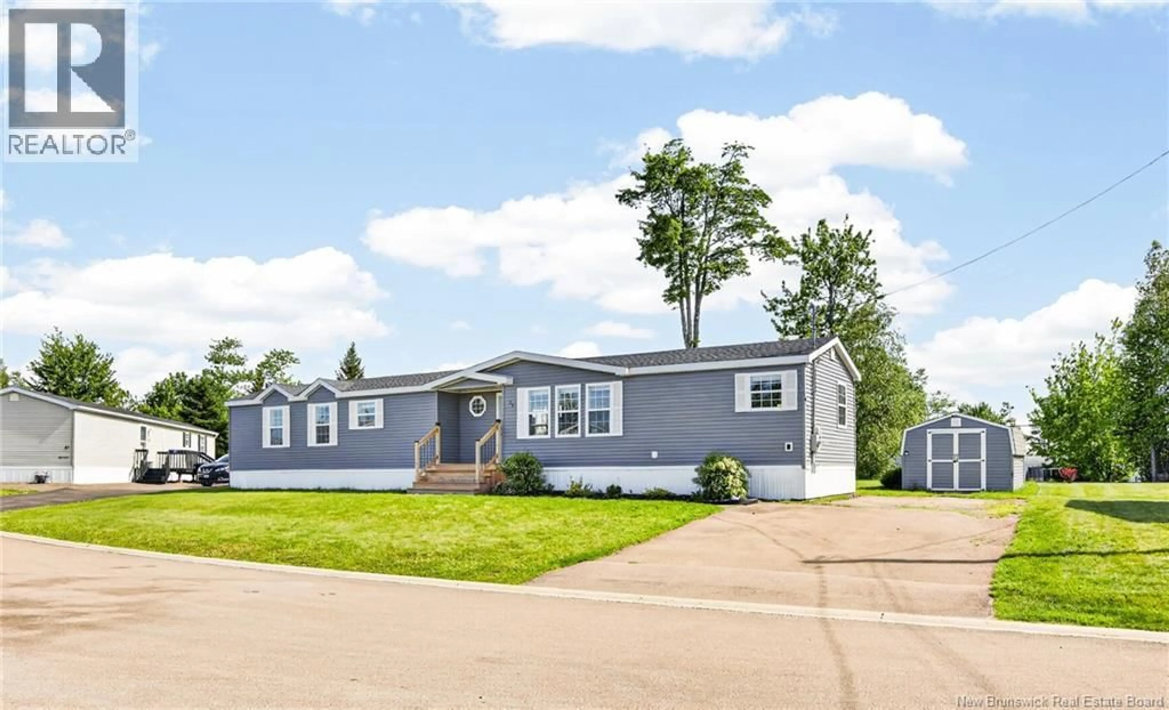 Home with vinyl exterior material, street for 35 RICHIBUCTOU, Dieppe New Brunswick E1A7N1