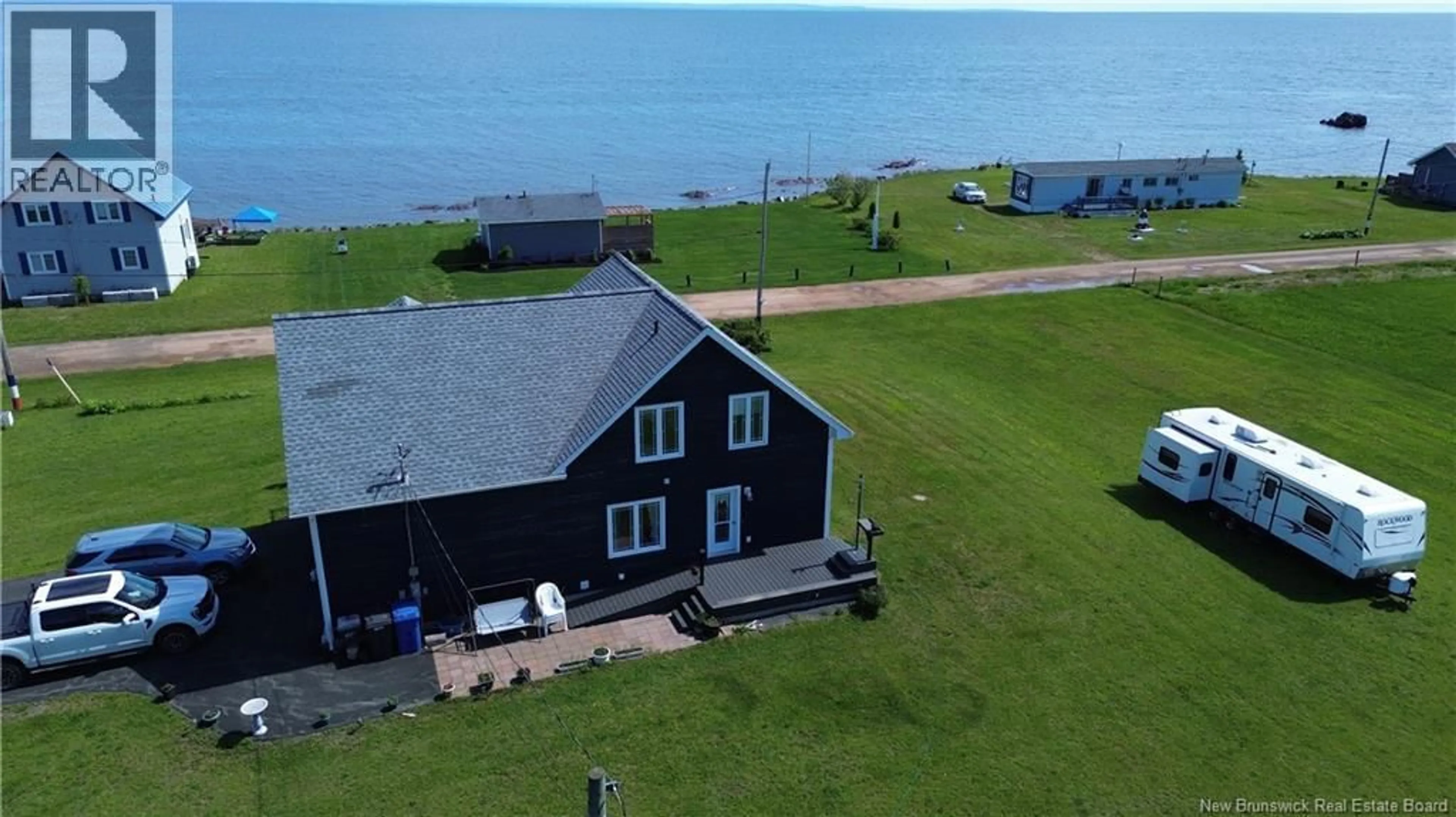 A pic from outside/outdoor area/front of a property/back of a property/a pic from drone, water/lake/river/ocean view for 78 RUE DES CHAMPS, Pointe-Verte New Brunswick E8J2V4