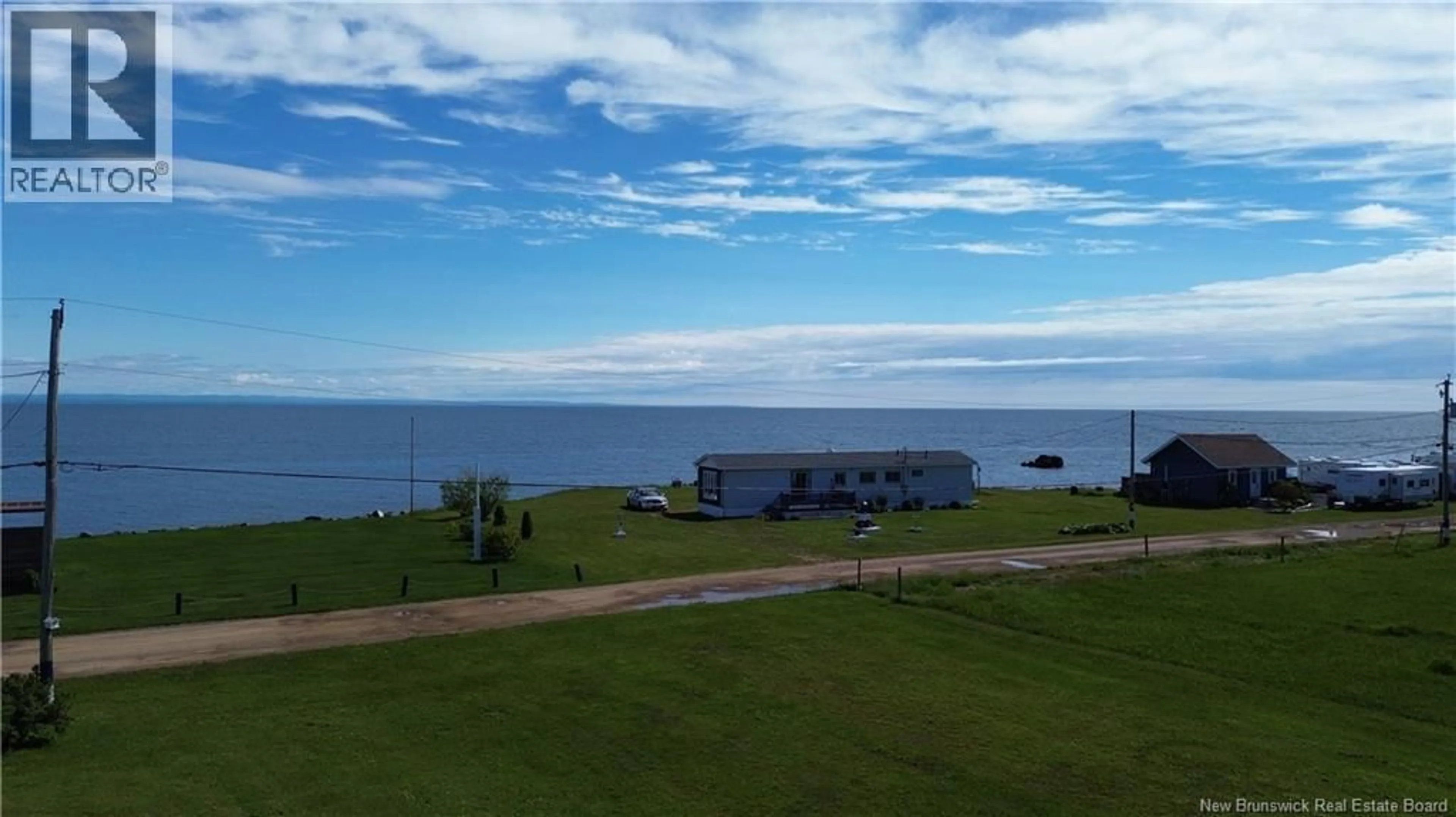 A pic from outside/outdoor area/front of a property/back of a property/a pic from drone, water/lake/river/ocean view for 78 RUE DES CHAMPS, Pointe-Verte New Brunswick E8J2V4