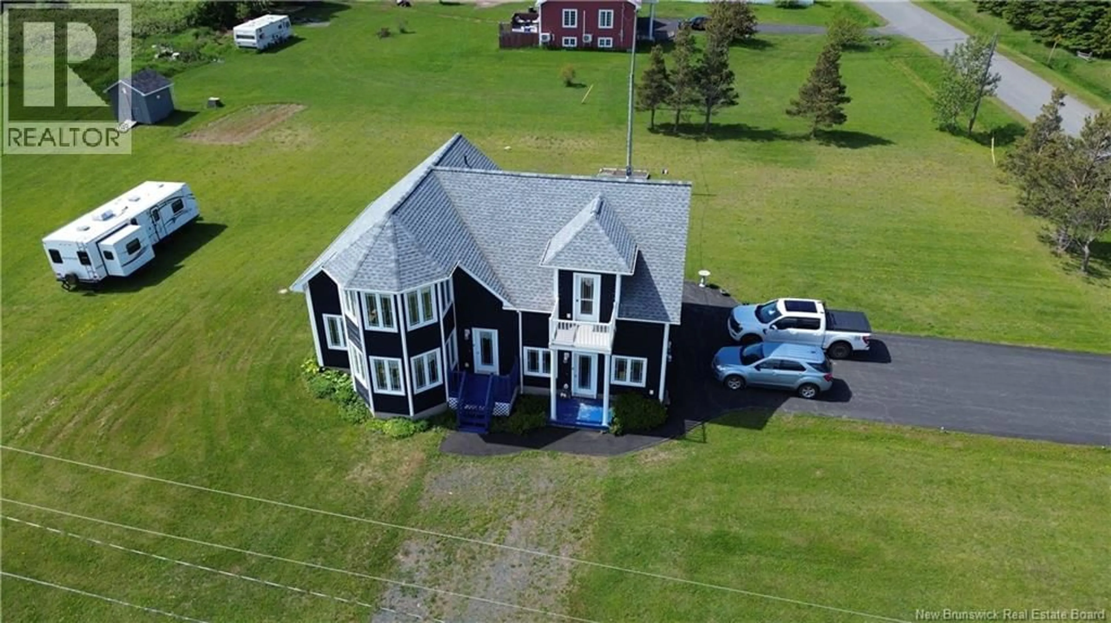 A pic from outside/outdoor area/front of a property/back of a property/a pic from drone, building for 78 RUE DES CHAMPS, Pointe-Verte New Brunswick E8J2V4