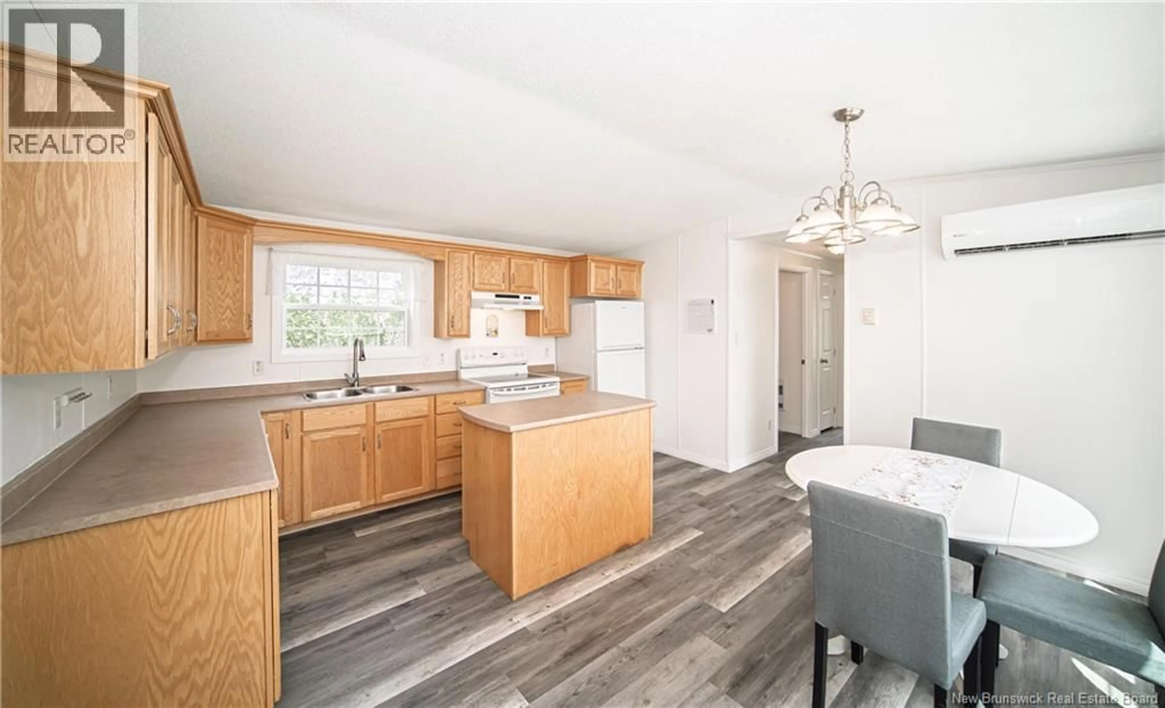 Open concept kitchen, wood/laminate floor for 16 BURTON STREET, Burton New Brunswick E2V2Z1