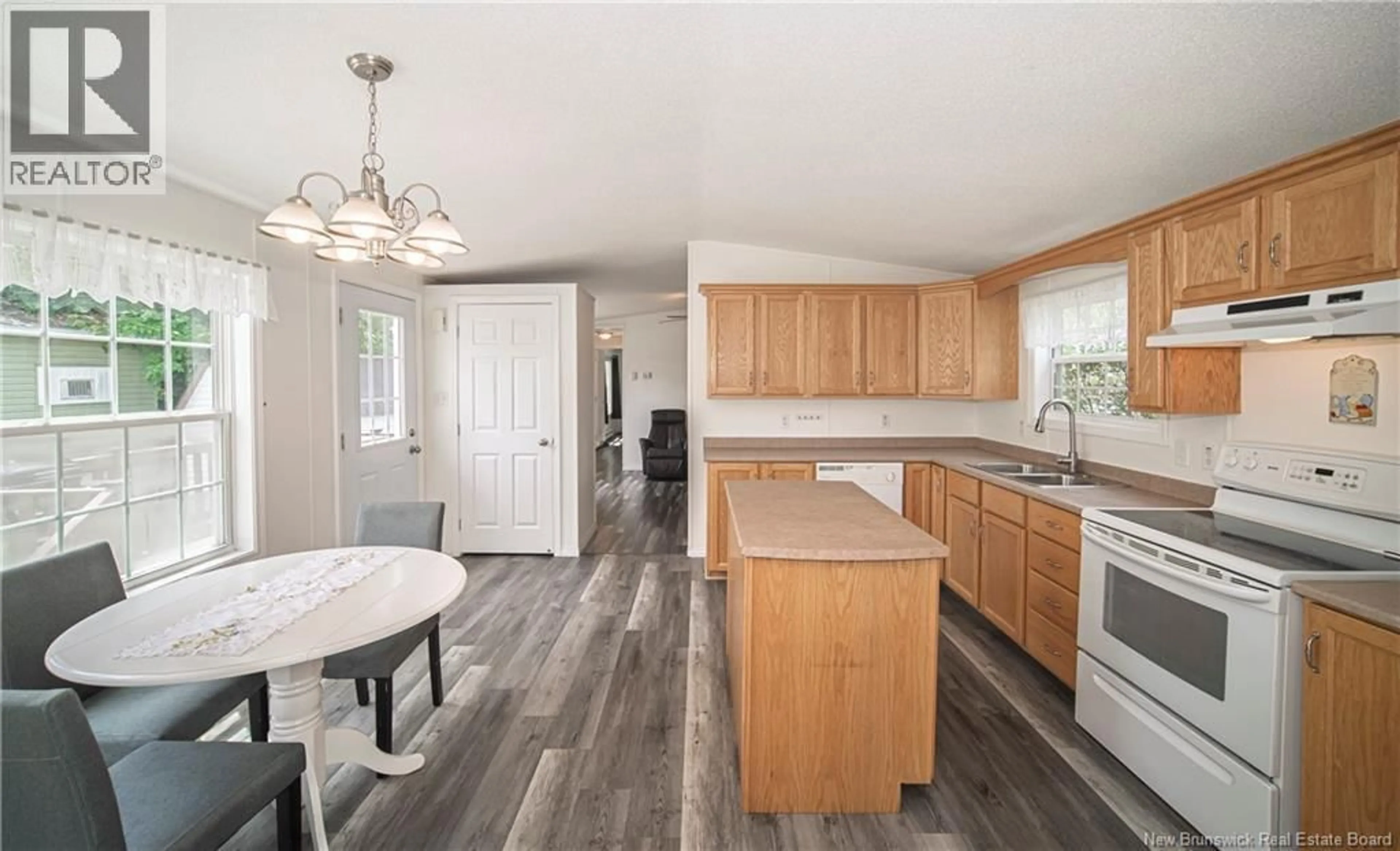 Open concept kitchen, wood/laminate floor for 16 BURTON STREET, Burton New Brunswick E2V2Z1