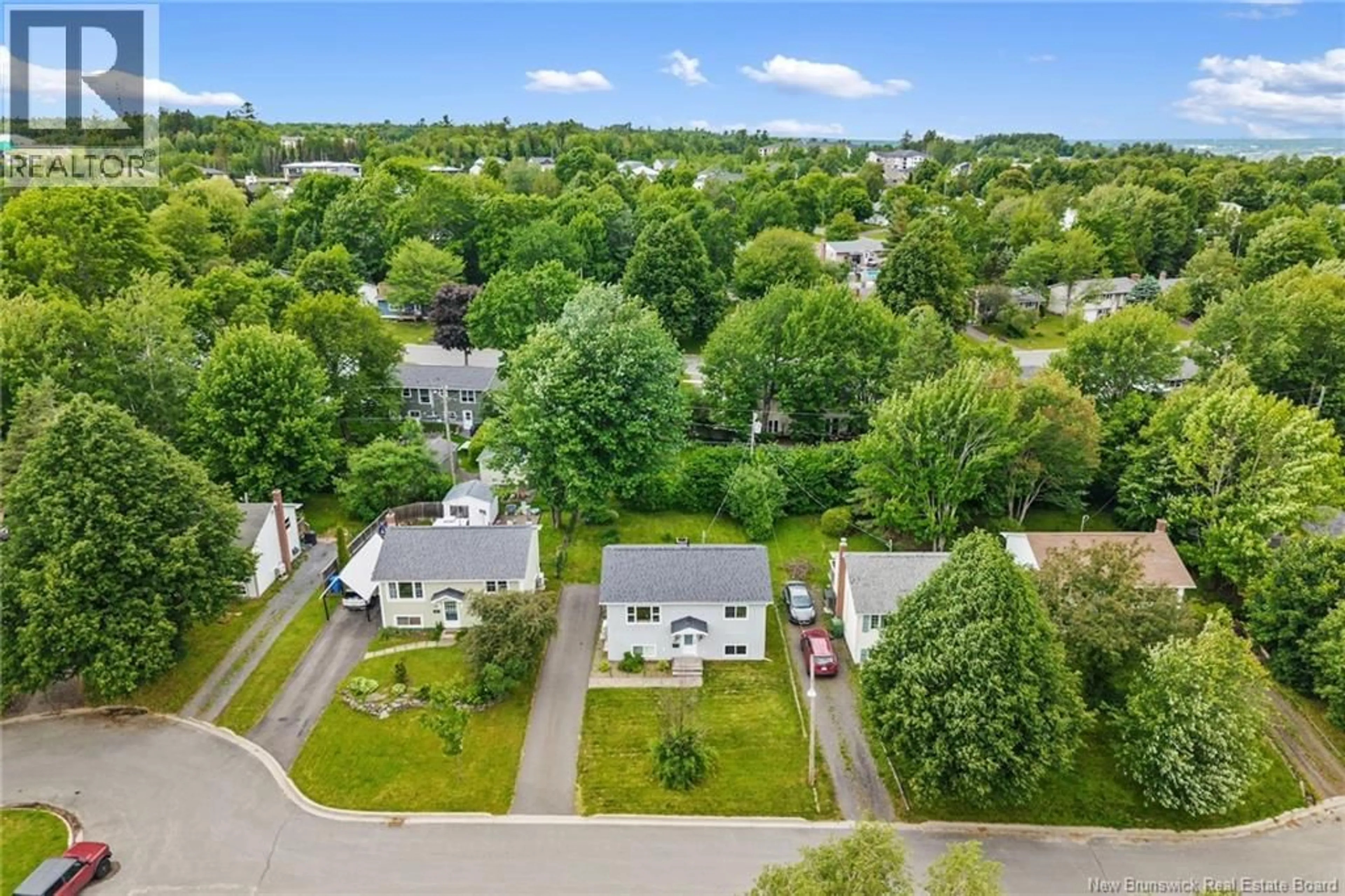 A pic from outside/outdoor area/front of a property/back of a property/a pic from drone, street for 65 HAZEN COURT, Fredericton New Brunswick E3B5K9