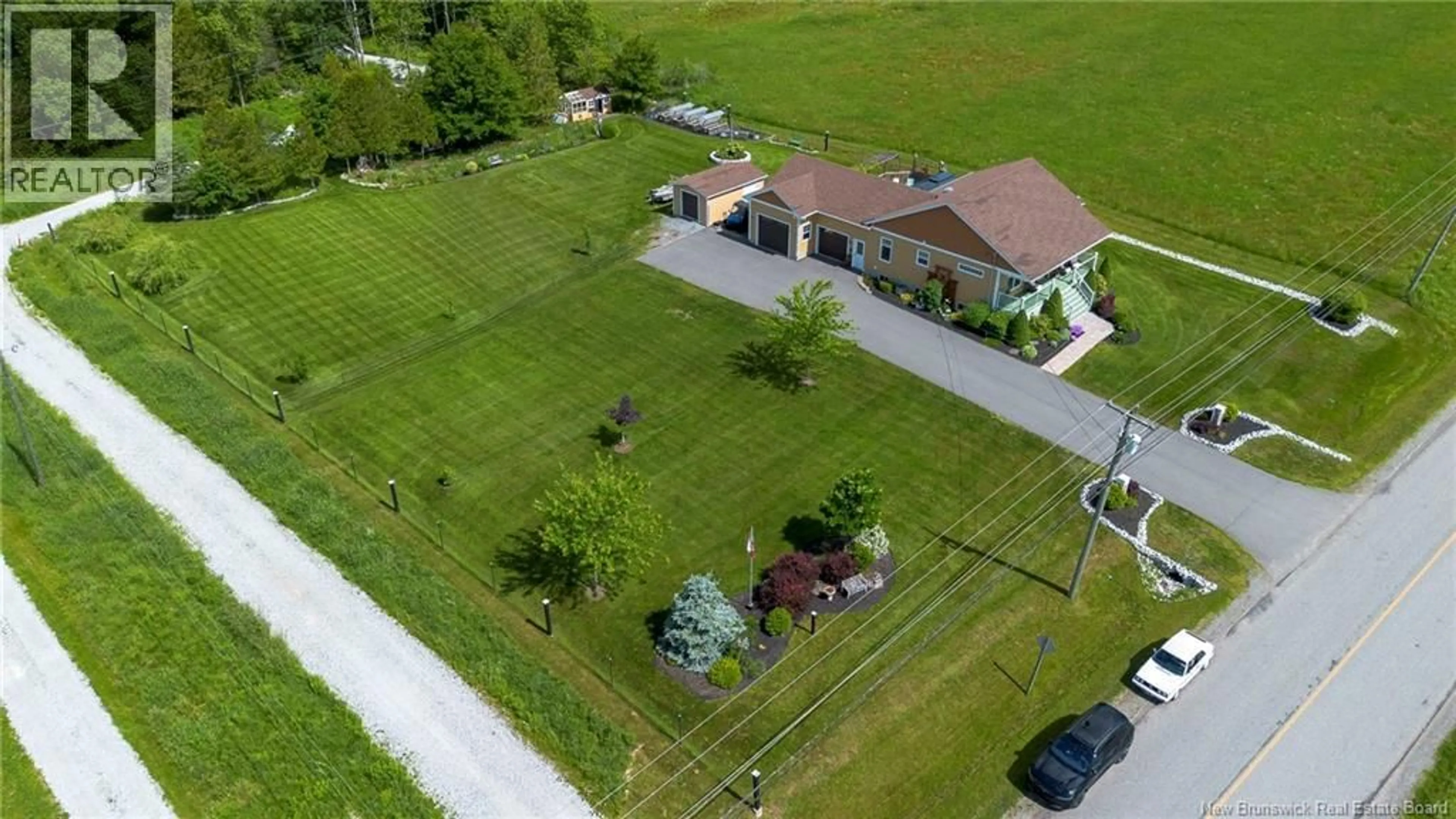 A pic from outside/outdoor area/front of a property/back of a property/a pic from drone, street for 315 DARLINGS ISLAND ROAD, Darlings Island New Brunswick E5N6S5