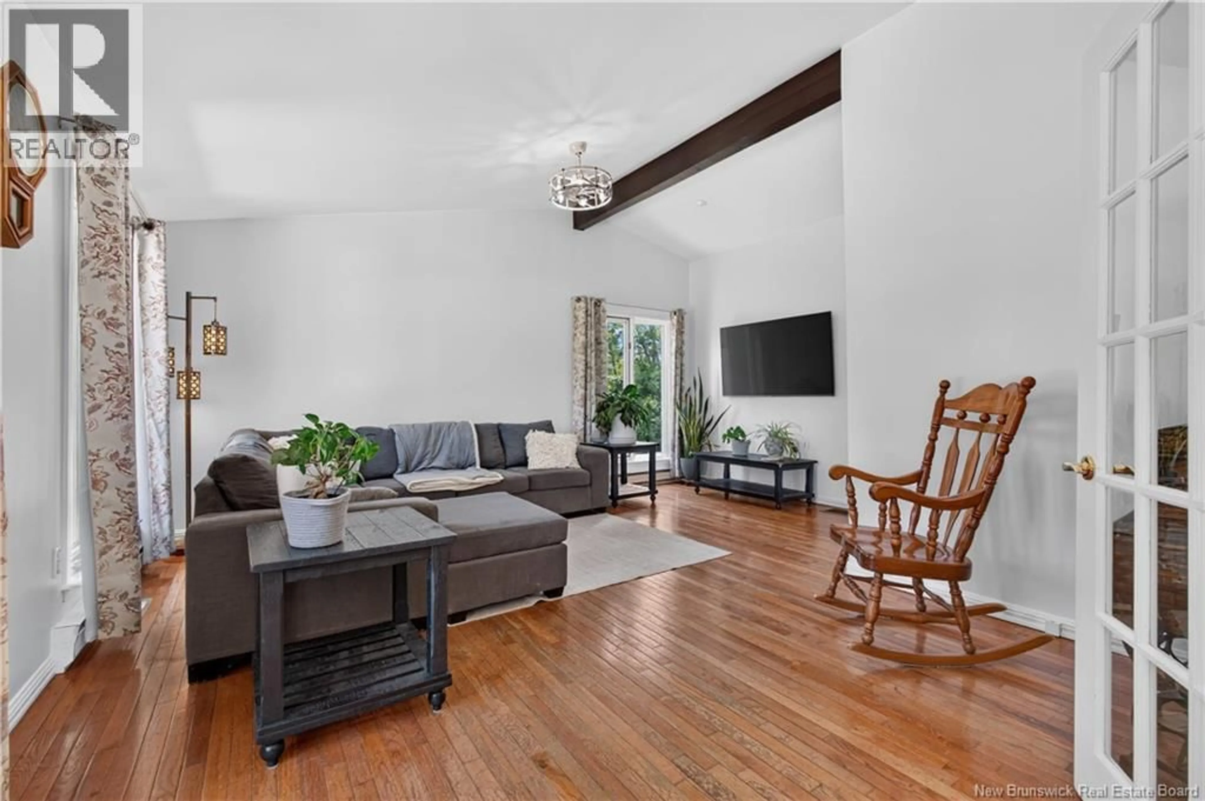 Living room with furniture, wood/laminate floor for 148 SUNRISE DRIVE, Miramichi New Brunswick E1V6Z9