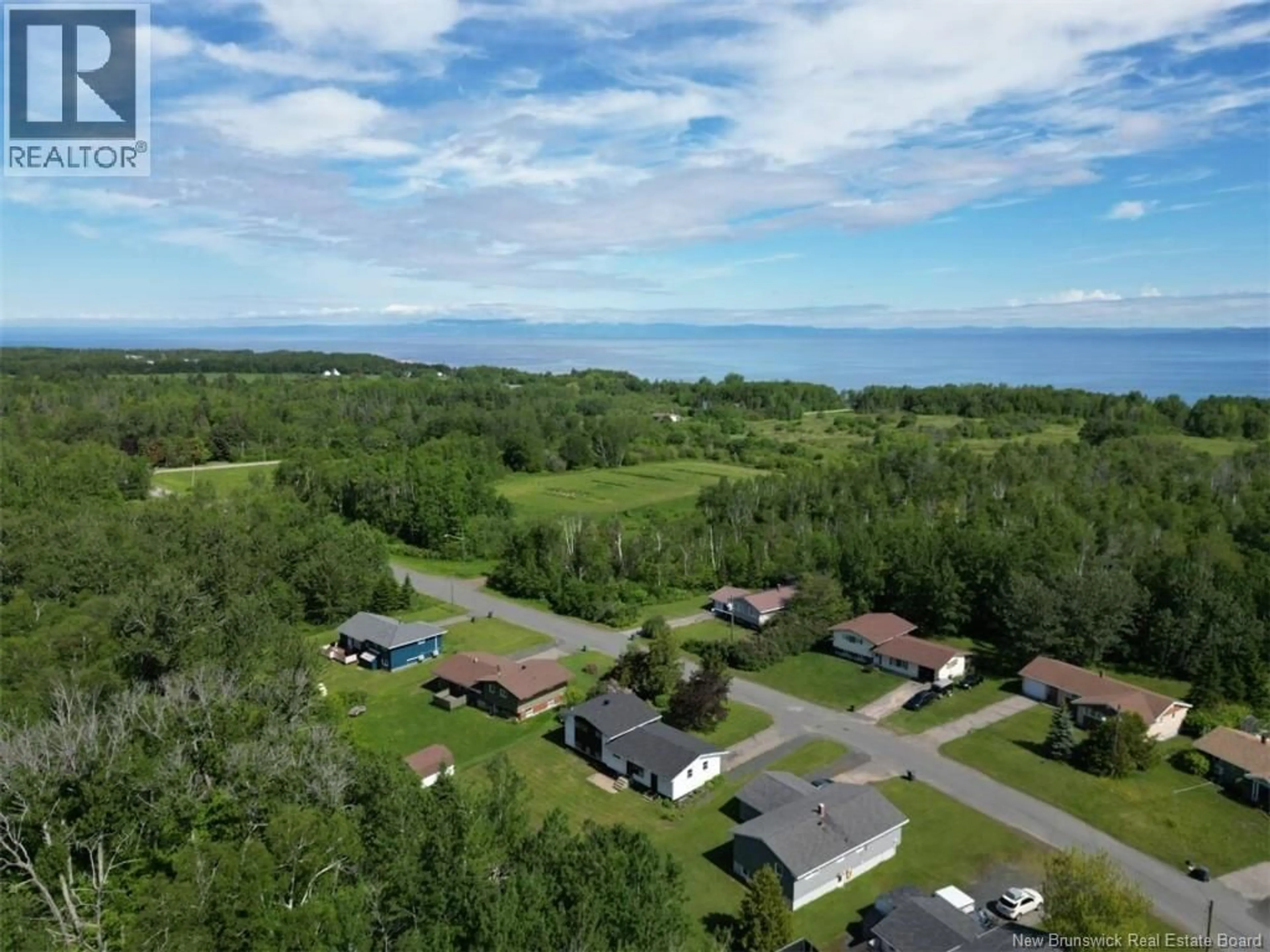 A pic from outside/outdoor area/front of a property/back of a property/a pic from drone, water/lake/river/ocean view for 58 CHALEUR, Belledune New Brunswick E8G1Z4