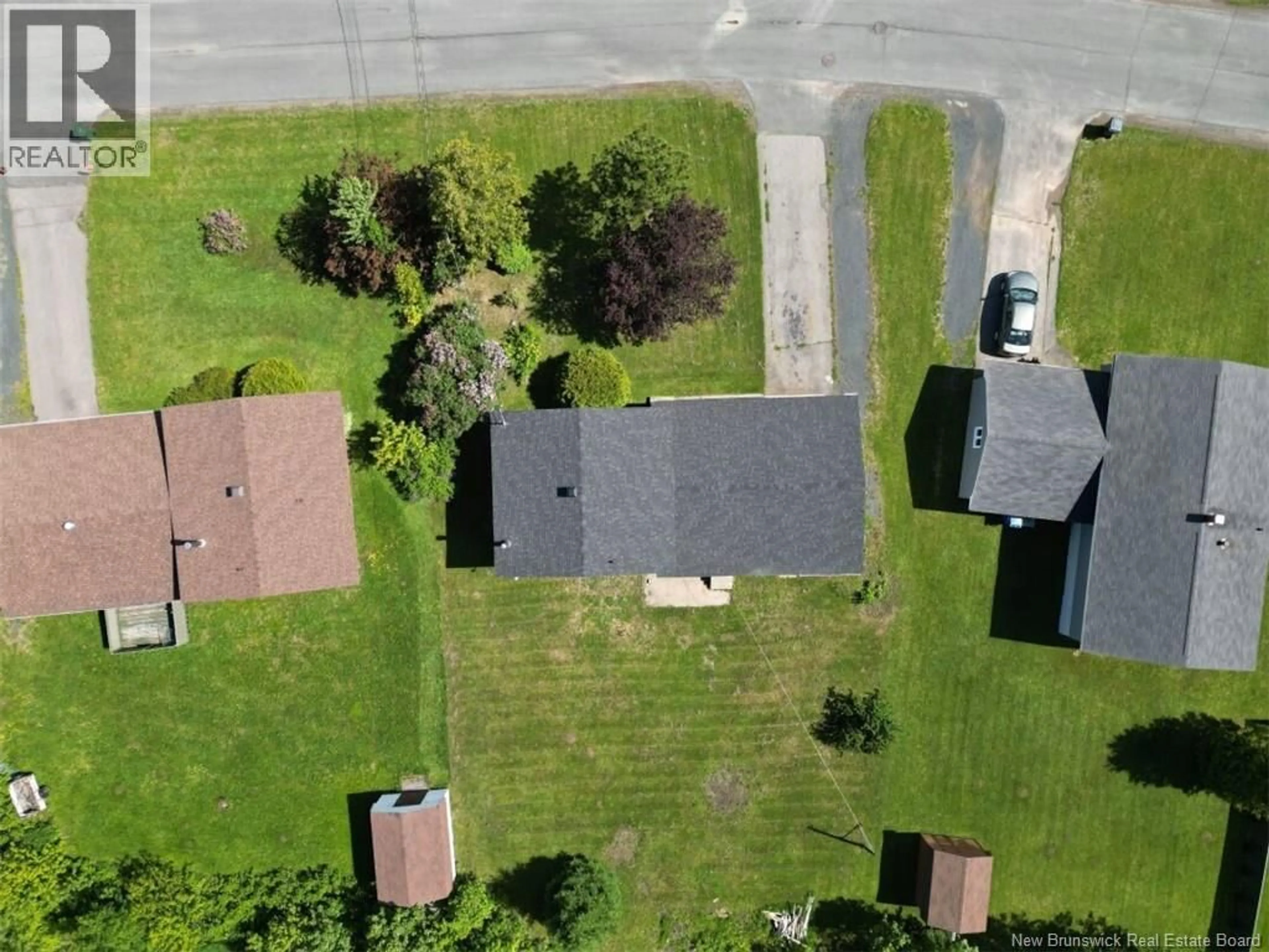 A pic from outside/outdoor area/front of a property/back of a property/a pic from drone, street for 58 CHALEUR, Belledune New Brunswick E8G1Z4