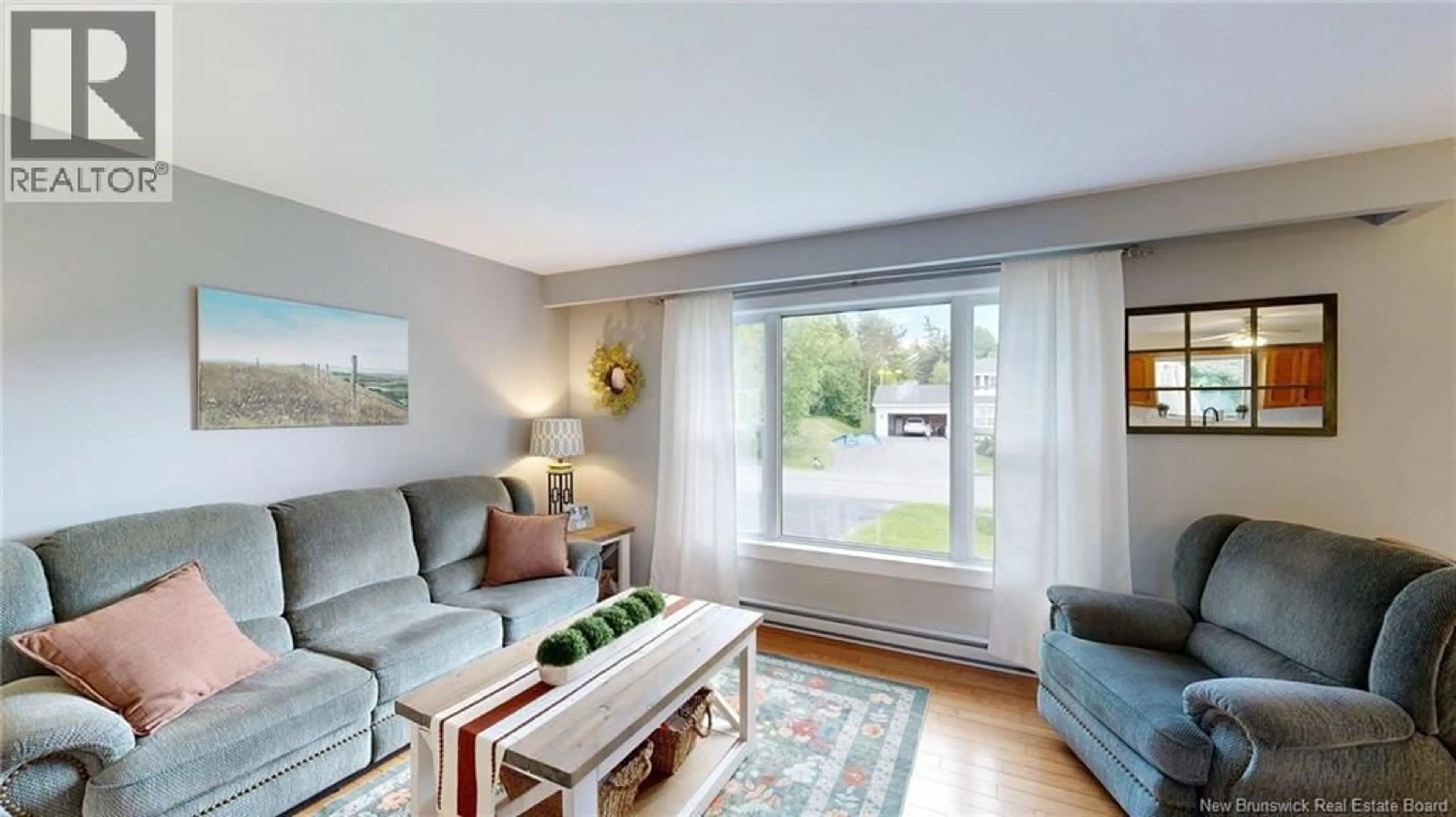 Living room with furniture, wood/laminate floor for 13 ELSIE DRIVE, Quispamsis New Brunswick E2E4R7