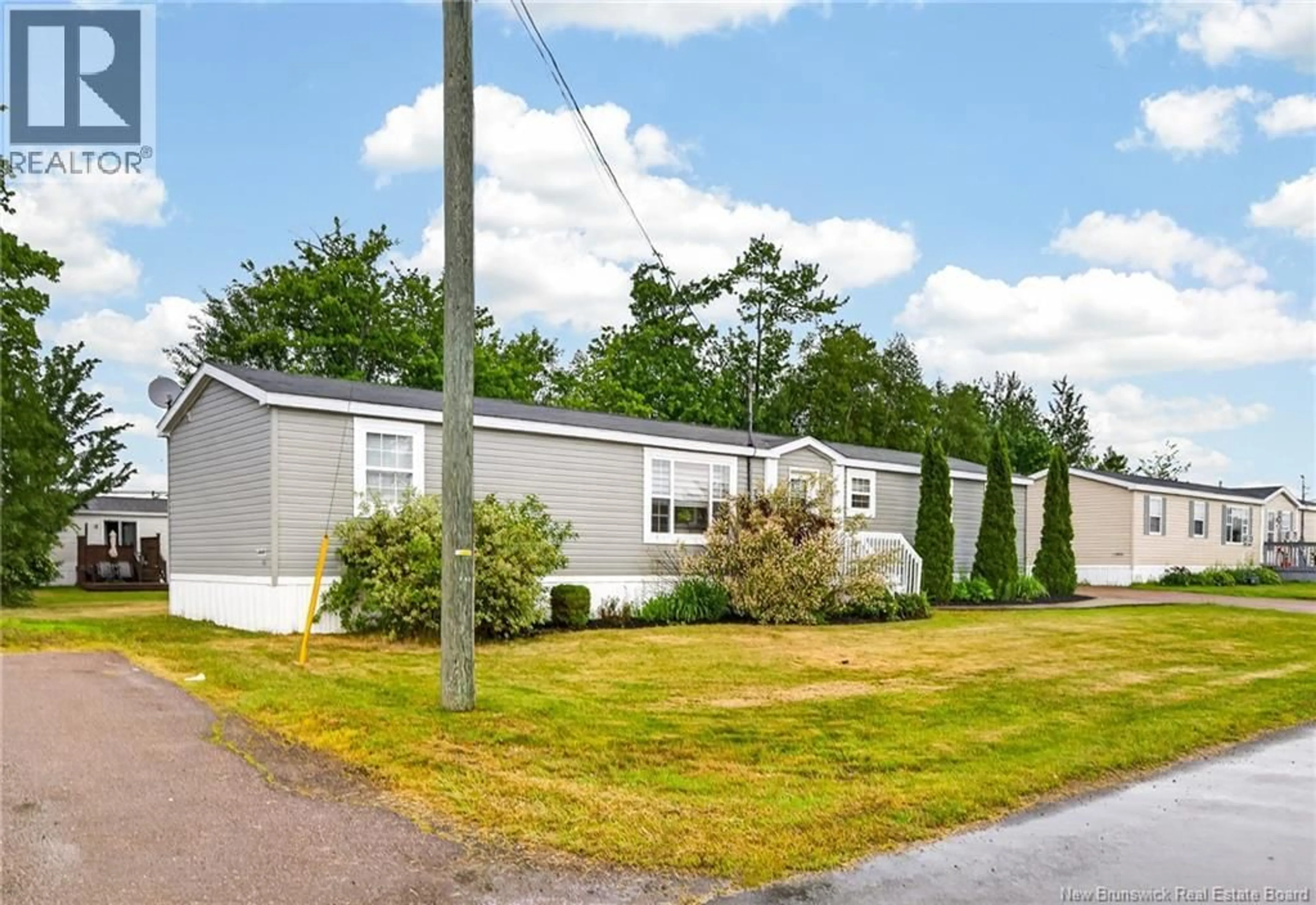 Home with vinyl exterior material, street for 82 TRACADIE, Dieppe New Brunswick E1A8P2