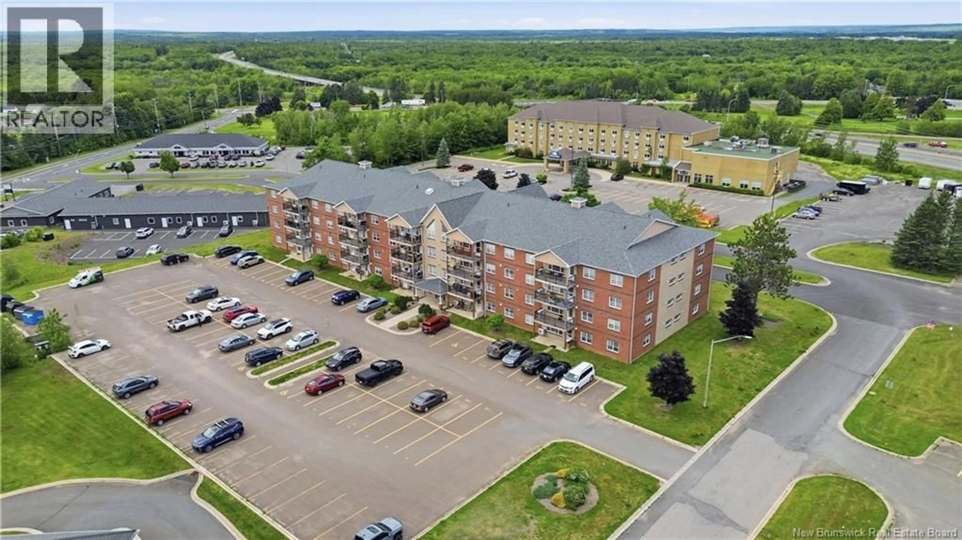 A pic from outside/outdoor area/front of a property/back of a property/a pic from drone, building for 101 - 65 BRAYSON BOULEVARD, Oromocto New Brunswick E2V0J2
