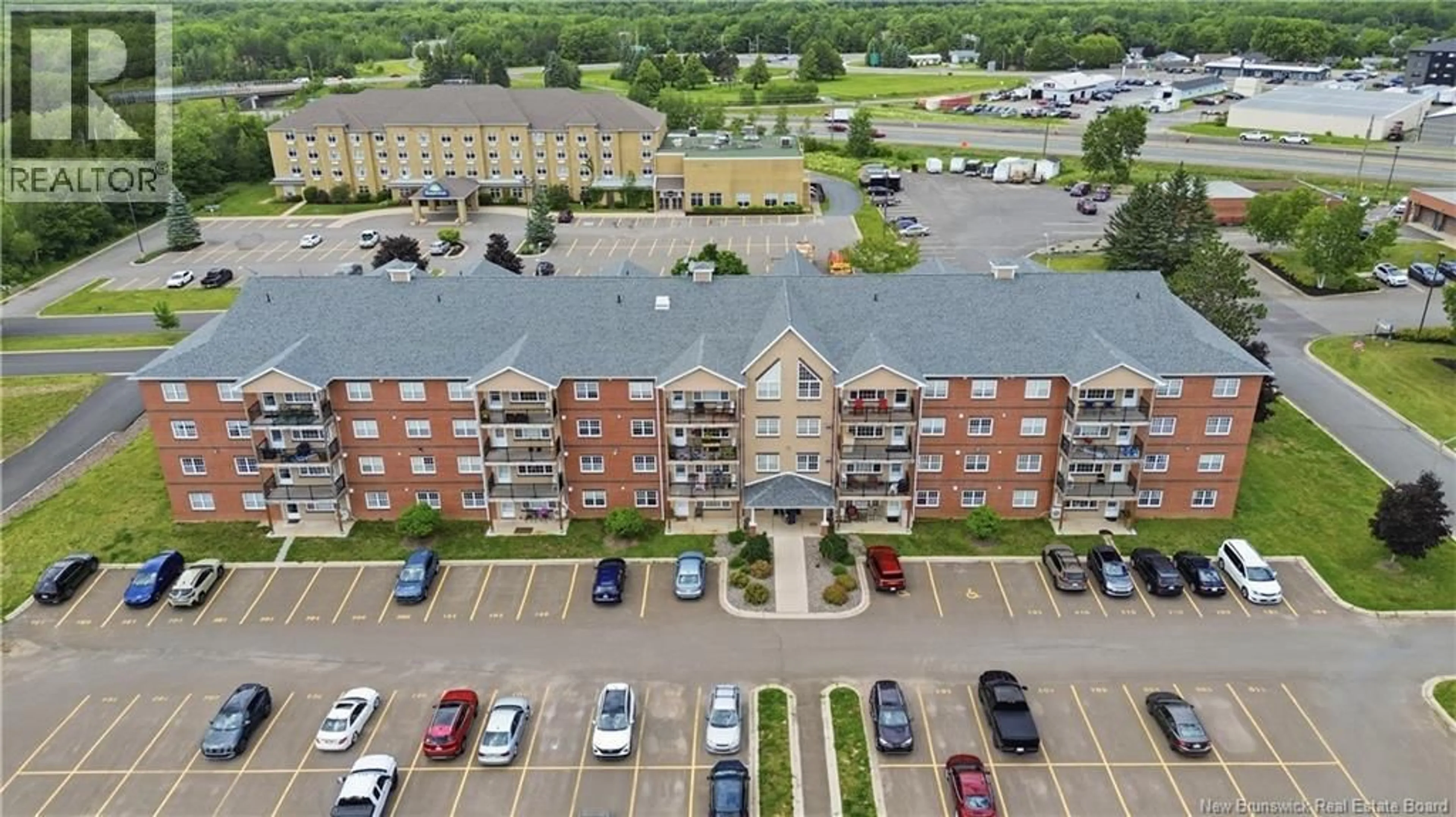 A pic from outside/outdoor area/front of a property/back of a property/a pic from drone, building for 101 - 65 BRAYSON BOULEVARD, Oromocto New Brunswick E2V0J2