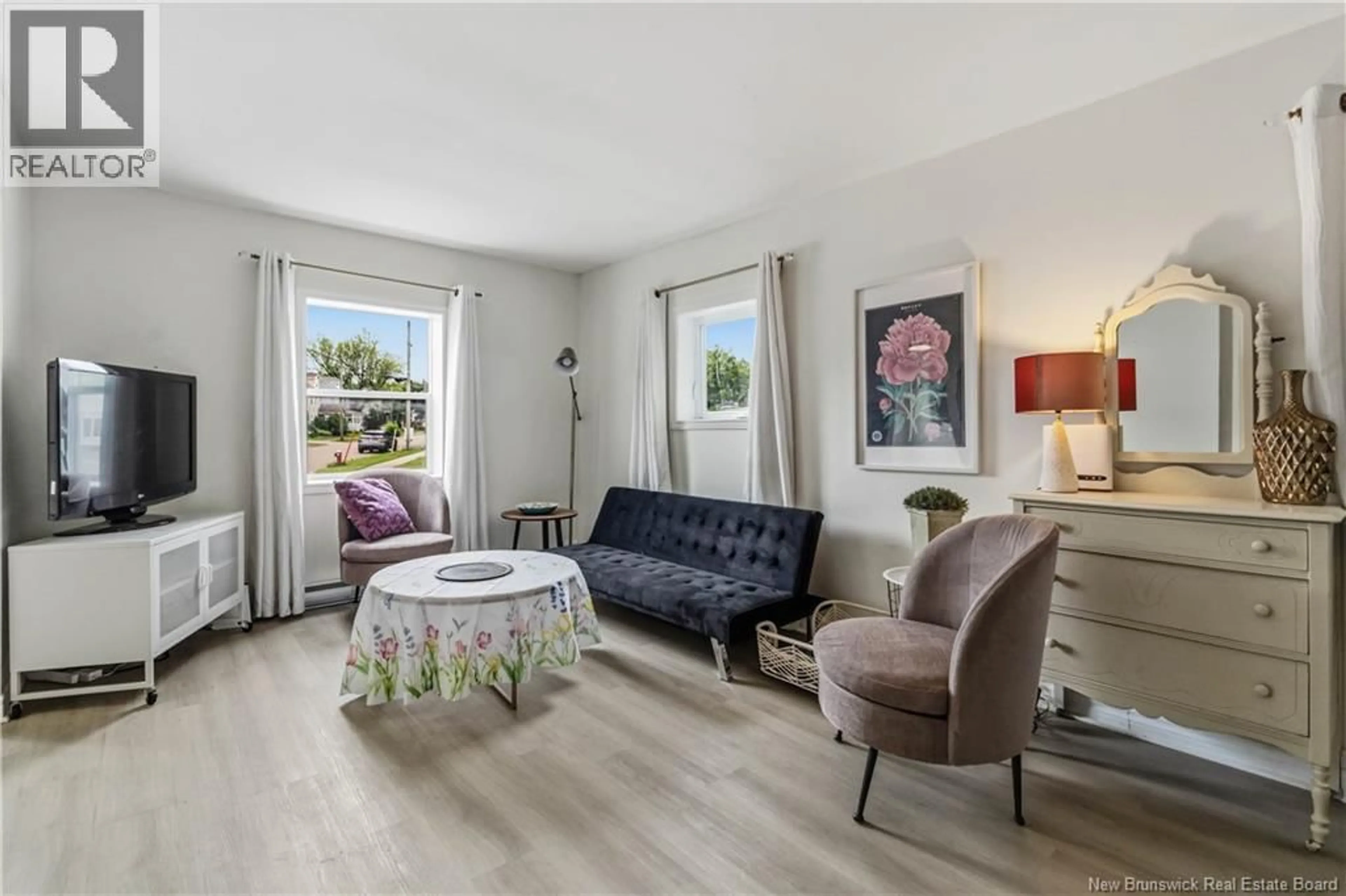 Living room with furniture, wood/laminate floor for 1484 MAIN STREET, Moncton New Brunswick E1E1G3