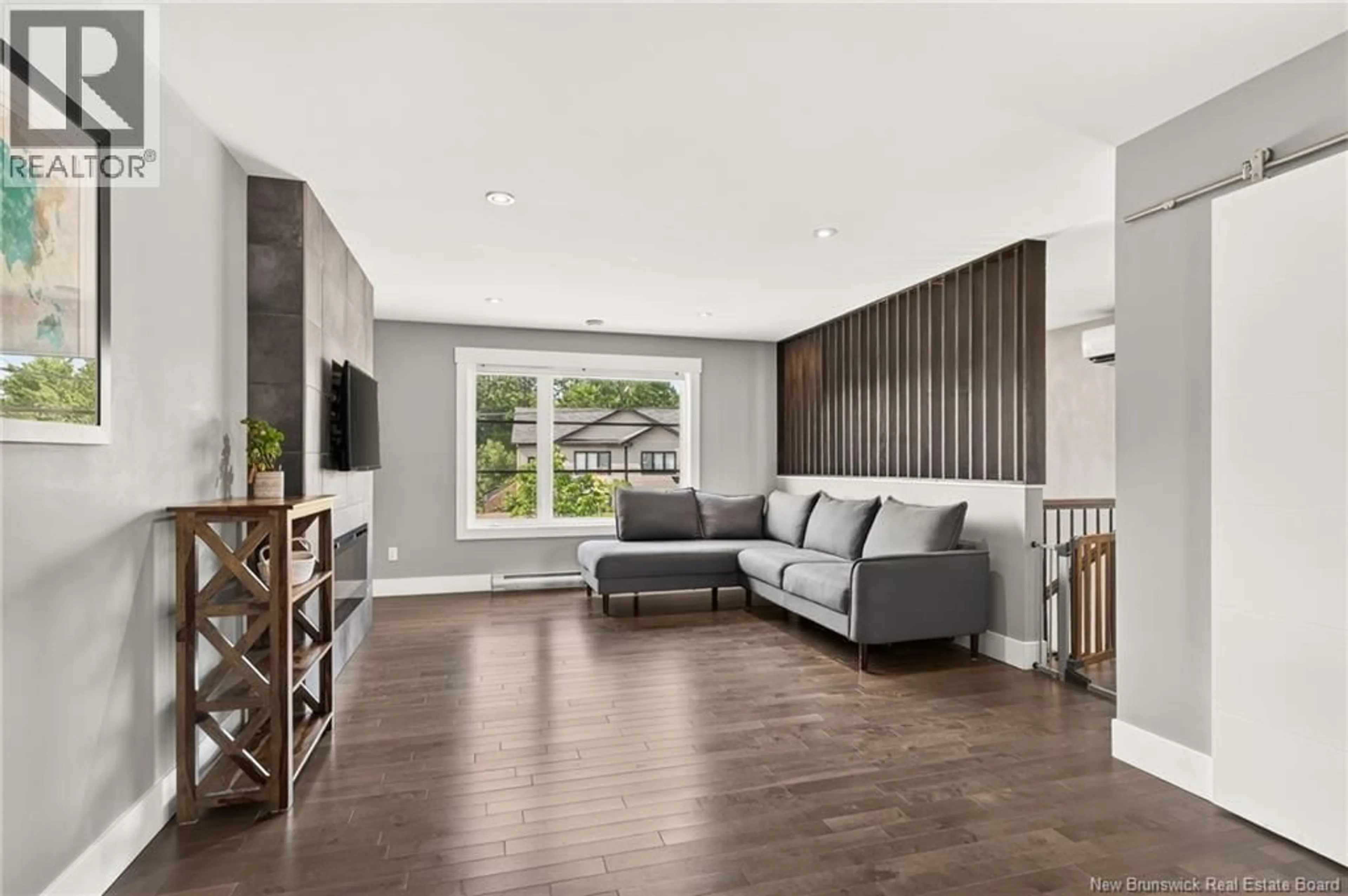 Living room with furniture, wood/laminate floor for 249 BELLE-FORÊT STREET, Dieppe New Brunswick E1A9E6