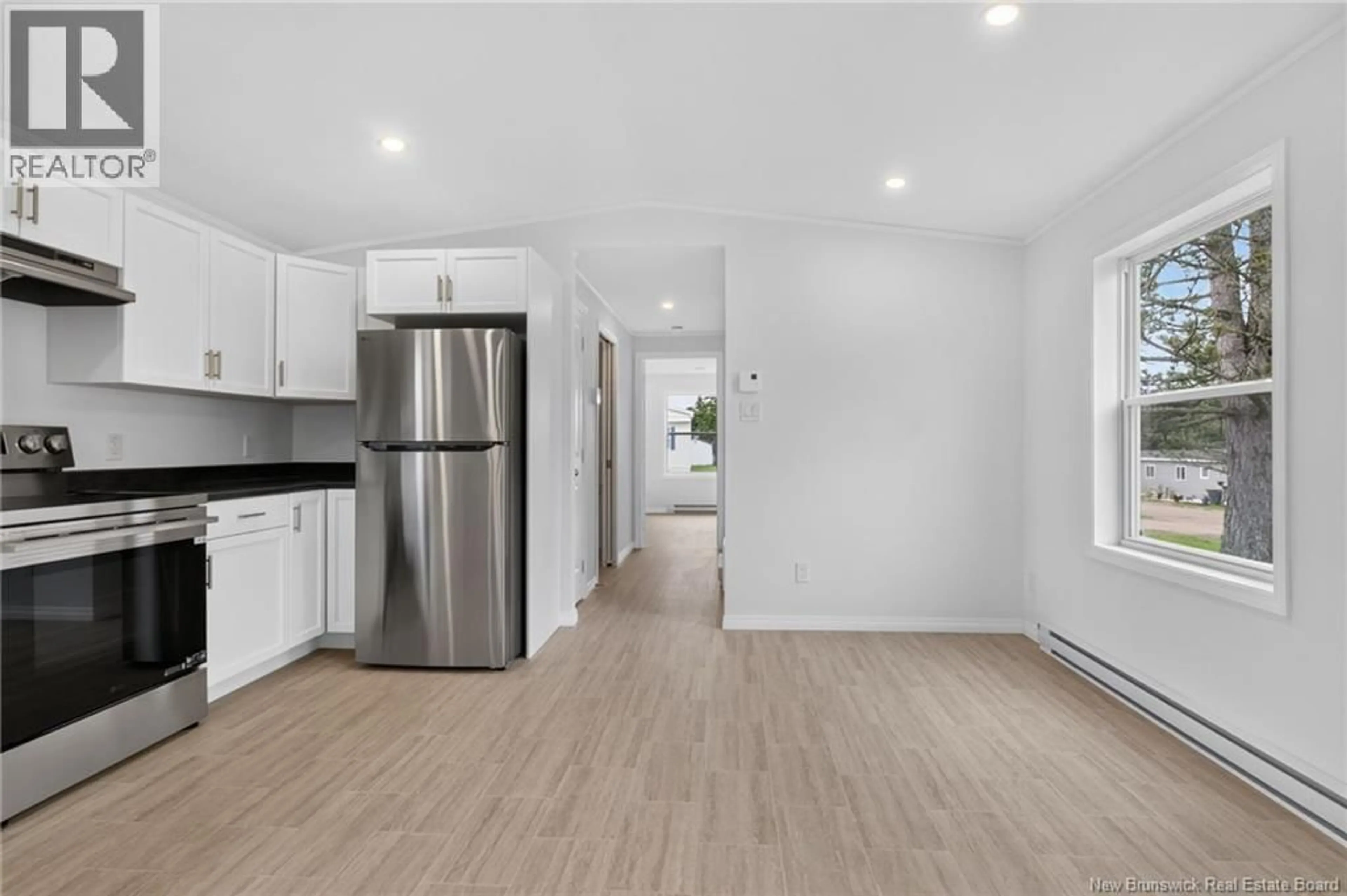 Open concept kitchen, wood/laminate floor for 10 LINDA LANE, Moncton New Brunswick E1E3T8