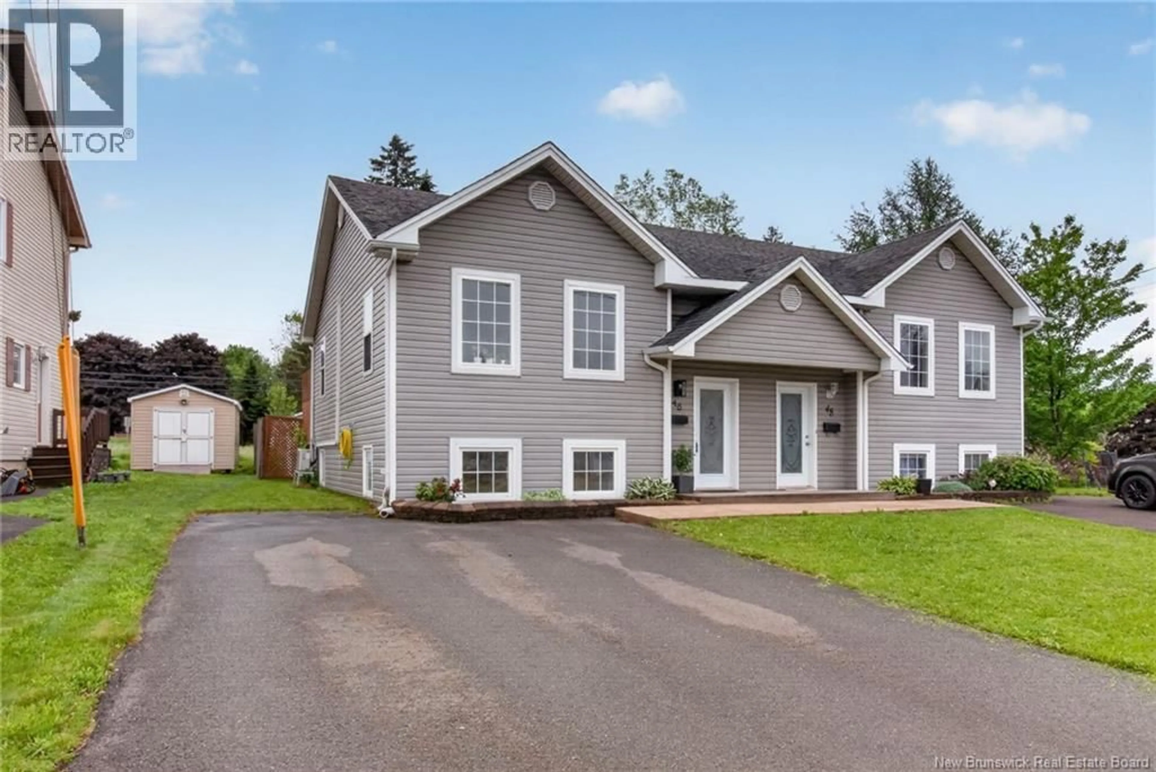 Home with vinyl exterior material, street for 46 DEVARENNE, Dieppe New Brunswick E1A0C8