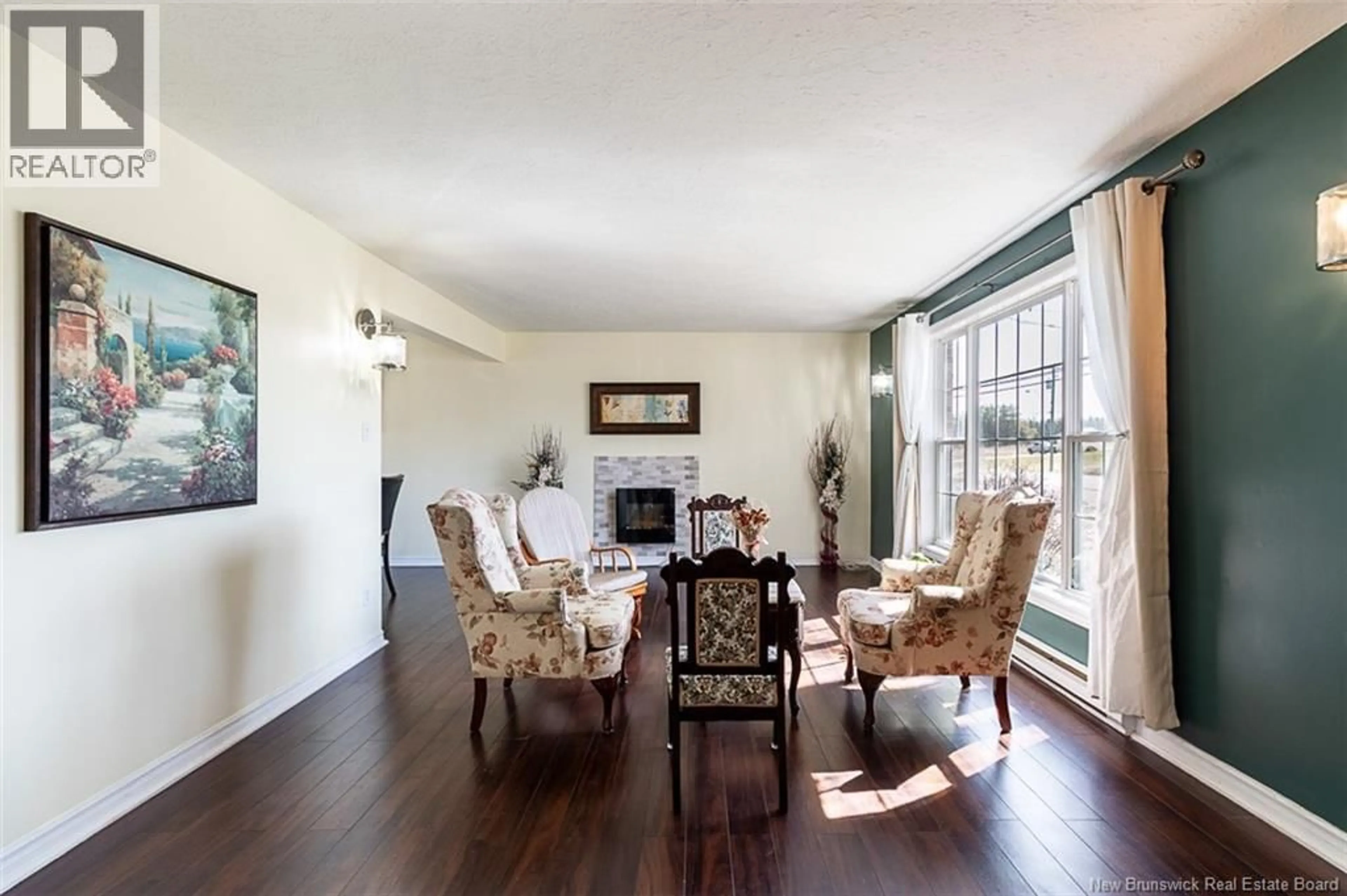 Living room with furniture, wood/laminate floor for 939 COVERDALE ROAD, Riverview New Brunswick E1B5E7