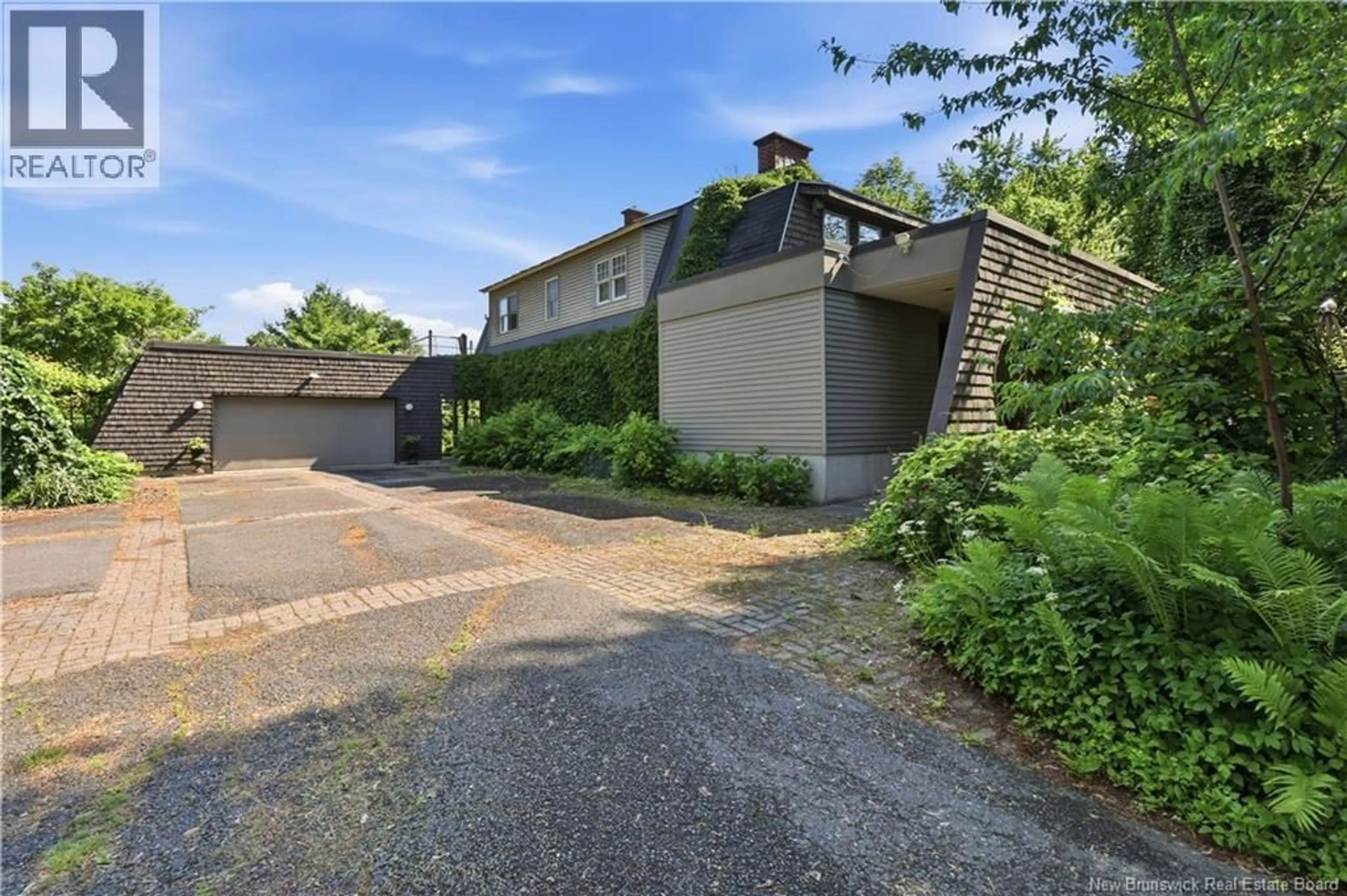 A pic from outside/outdoor area/front of a property/back of a property/a pic from drone, street for 1421 WOODSTOCK ROAD, Fredericton New Brunswick E3C1P2